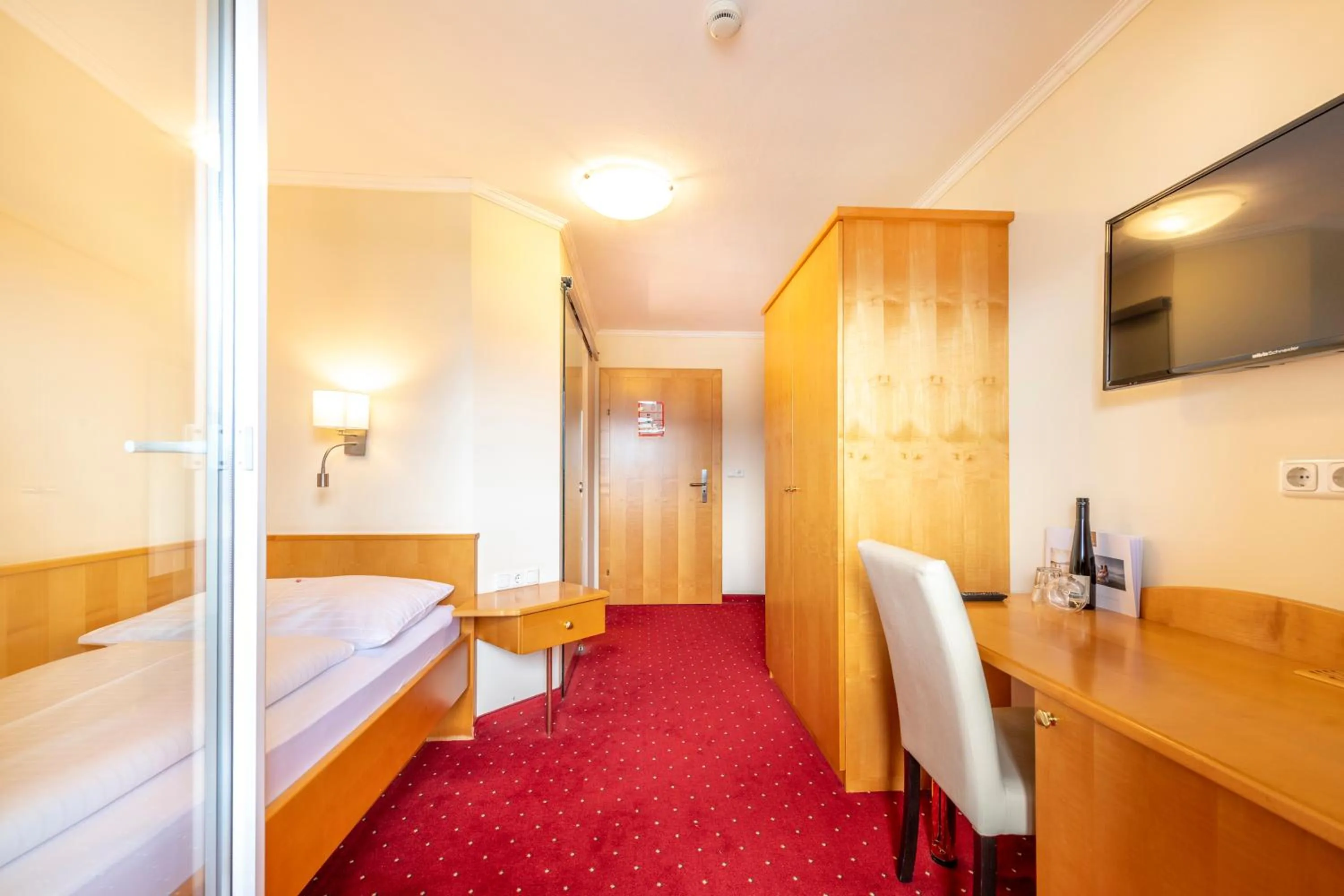 Photo of the whole room, Bed in Panorama Hotel Traunstein