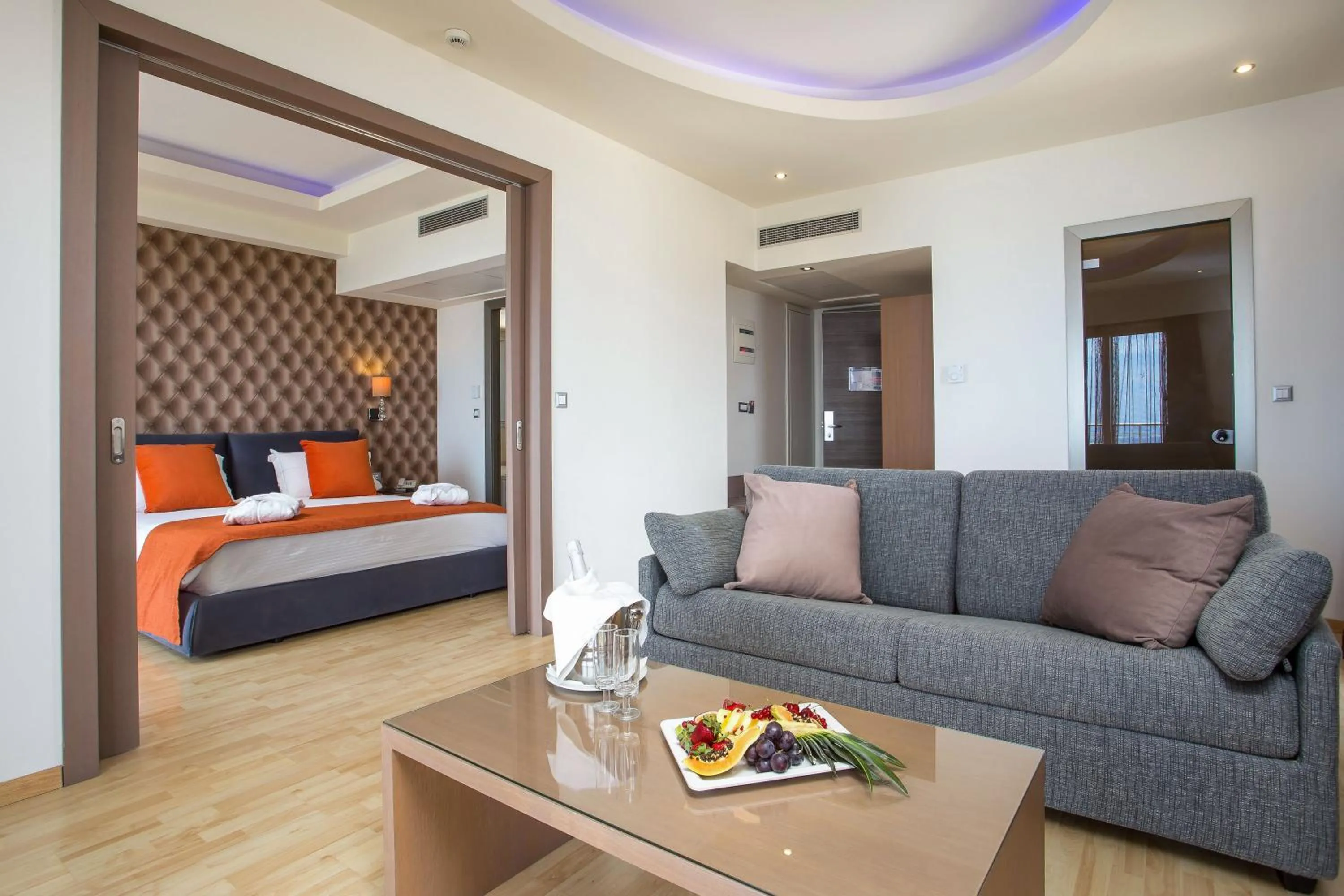 Living room, Bed in Pegasos Deluxe Beach Hotel