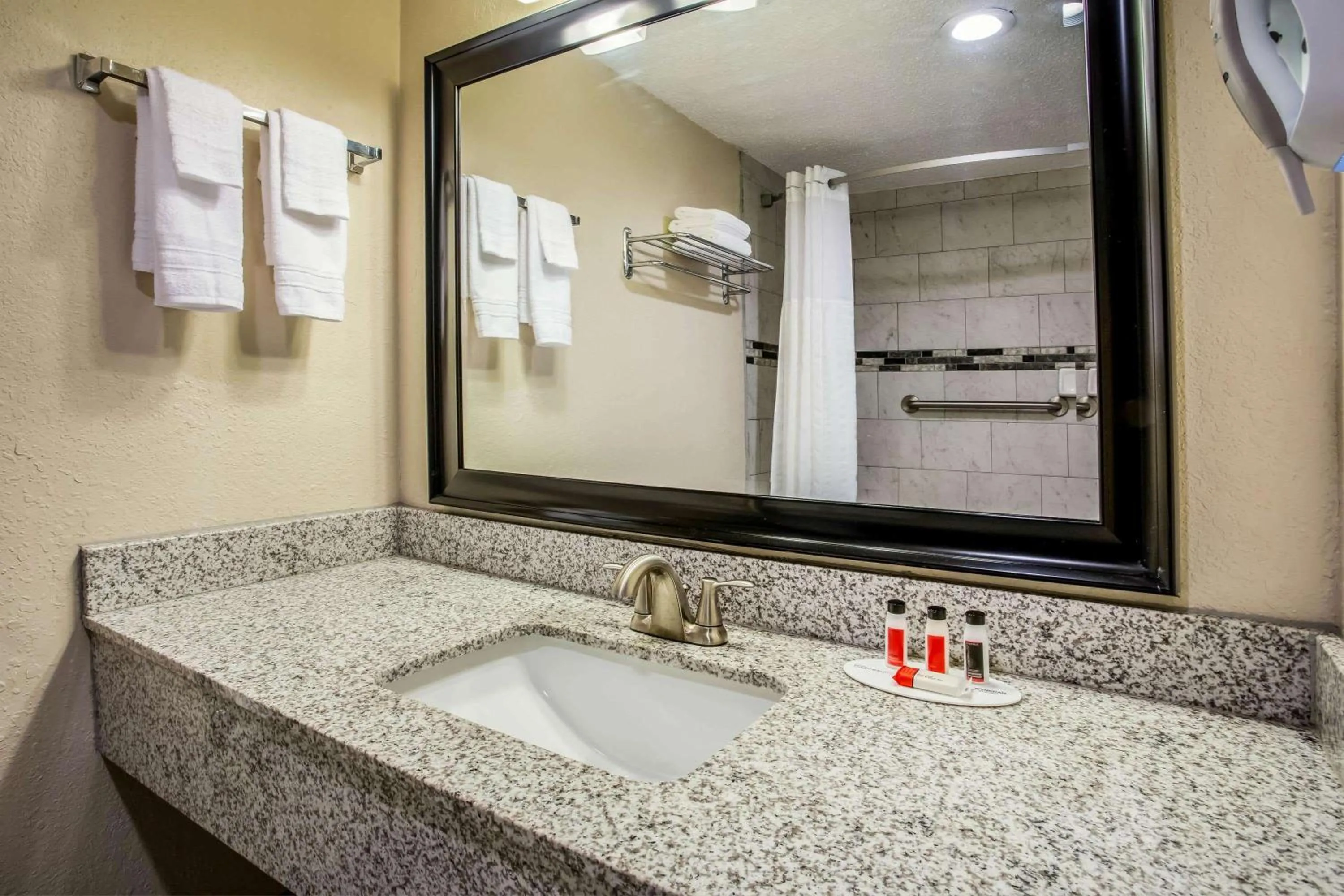 Bathroom in Super 8 by Wyndham Lake City