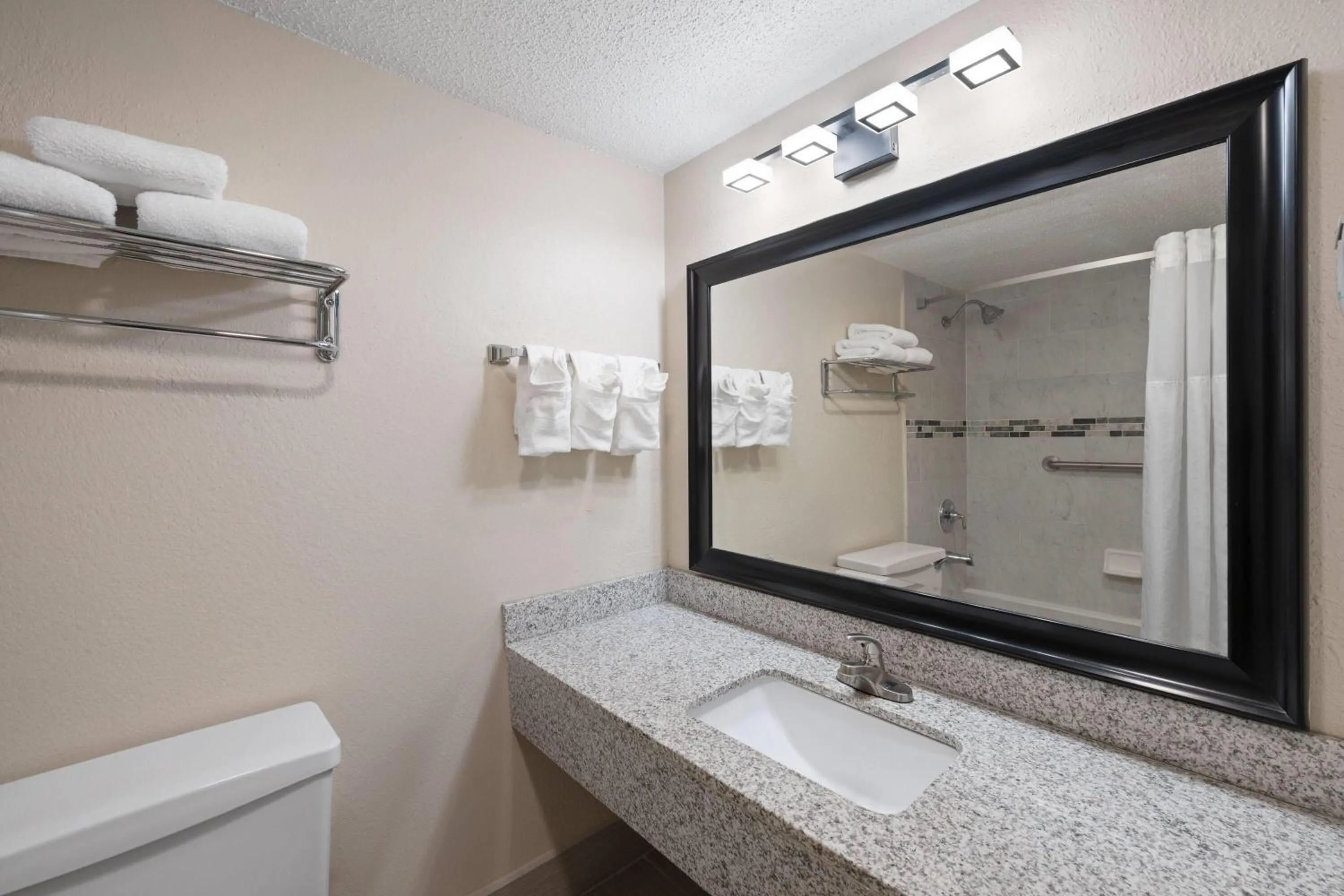 Bathroom in Super 8 by Wyndham Lake City