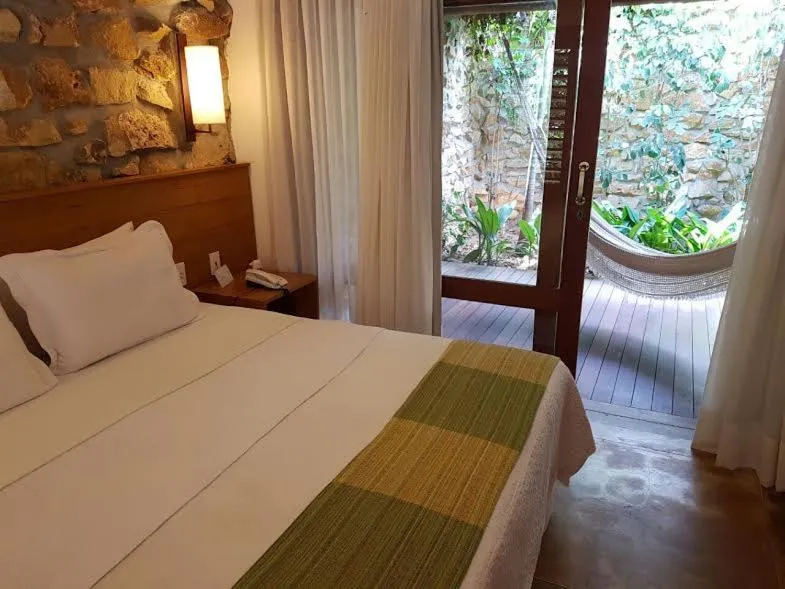 Bed in Pousada dos Ponteiros