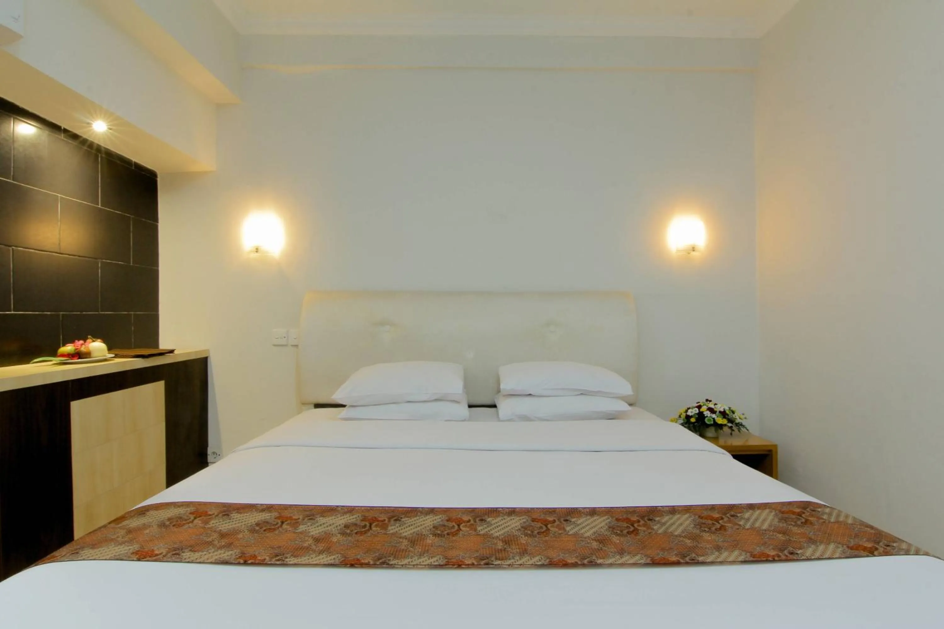 Bed in University Hotel Yogyakarta