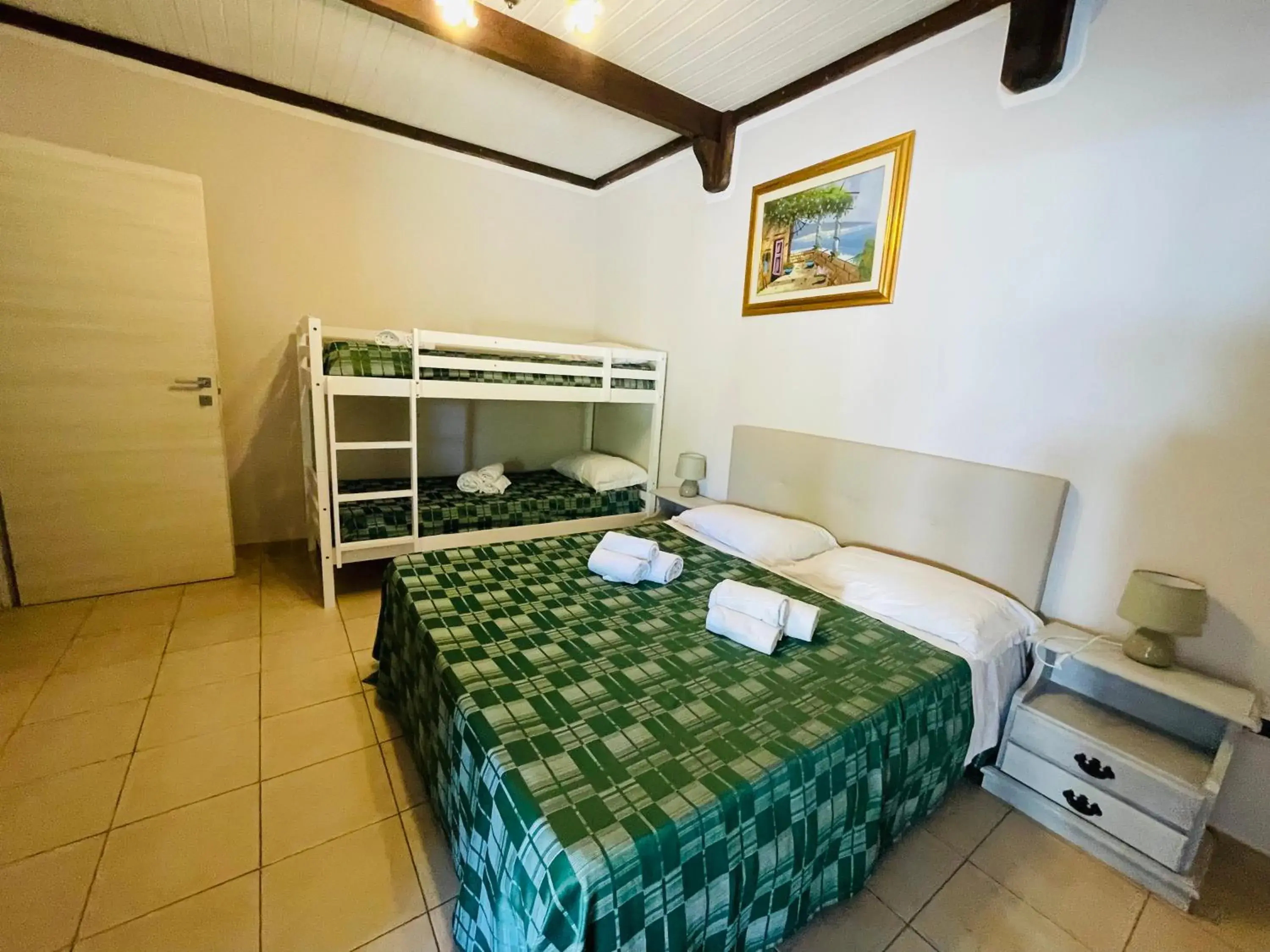 Family Room in Albergo Hotel Villaggio Ristorante Tanit Family Room in Albergo Hotel Villaggio Ristorante Tanit