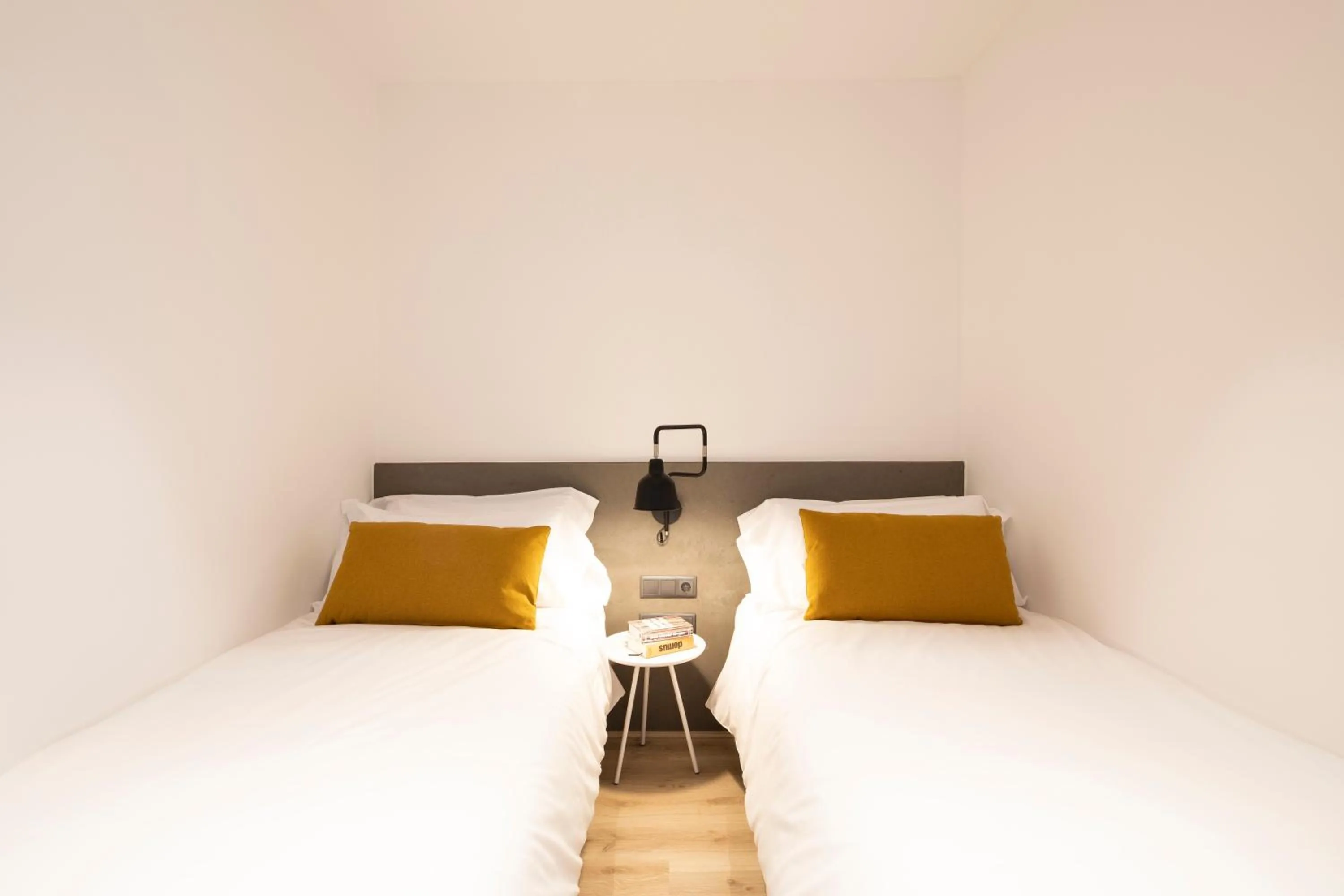 Bed in Aspasios Sagrada Familia Apartments