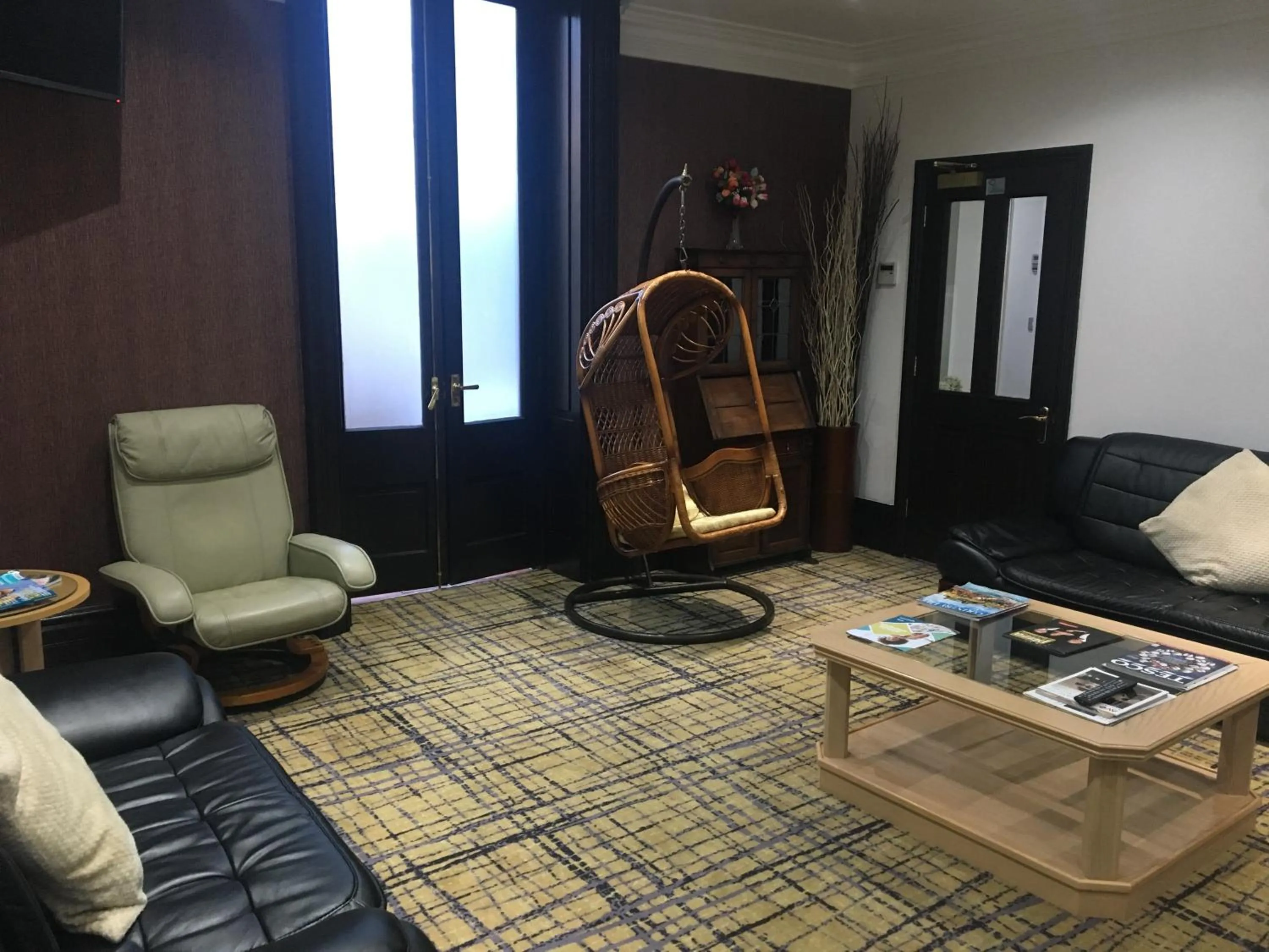 Communal lounge/ TV room in Harefield Manor Hotel