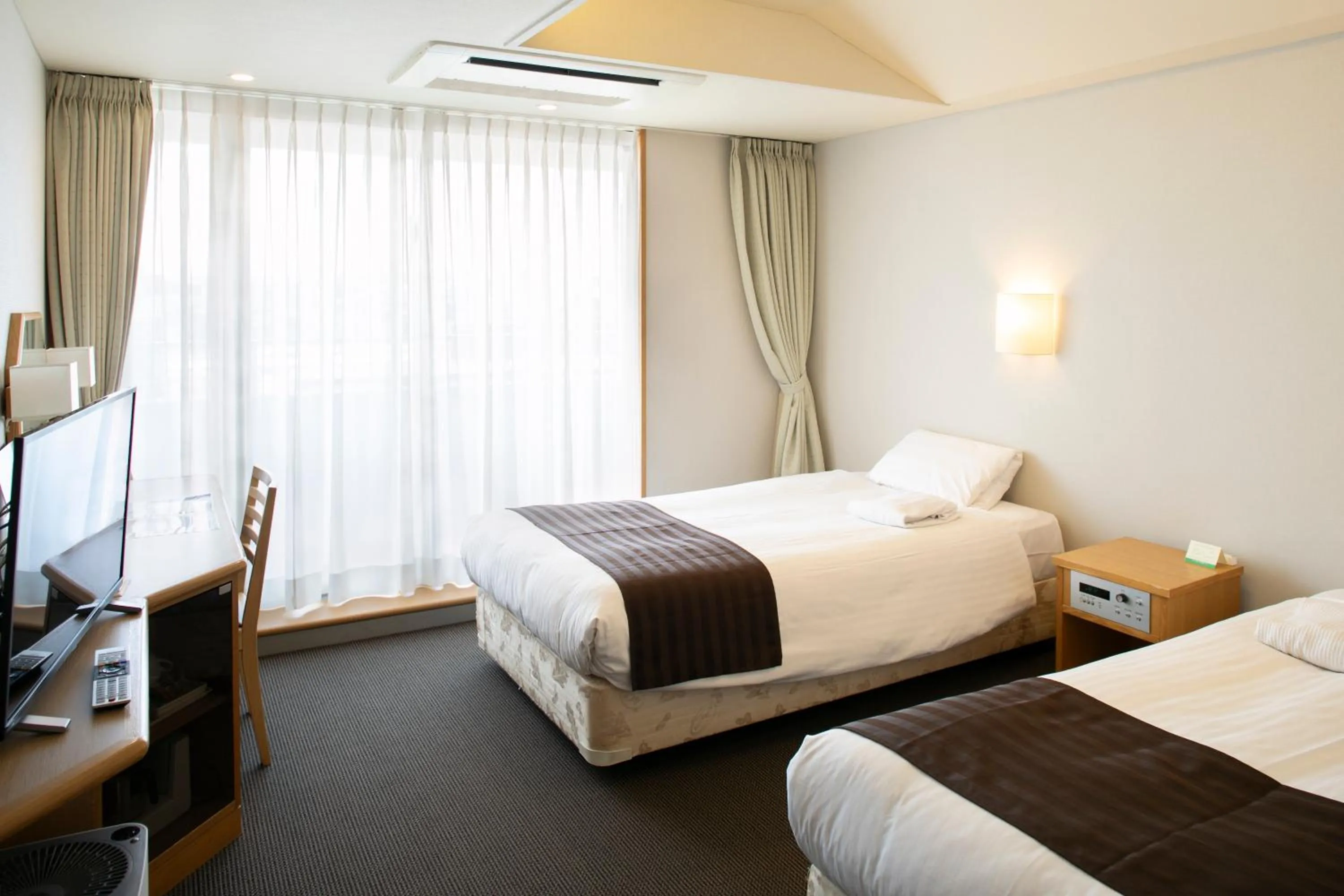 Bed in Hotel Plaza Annex Yokote