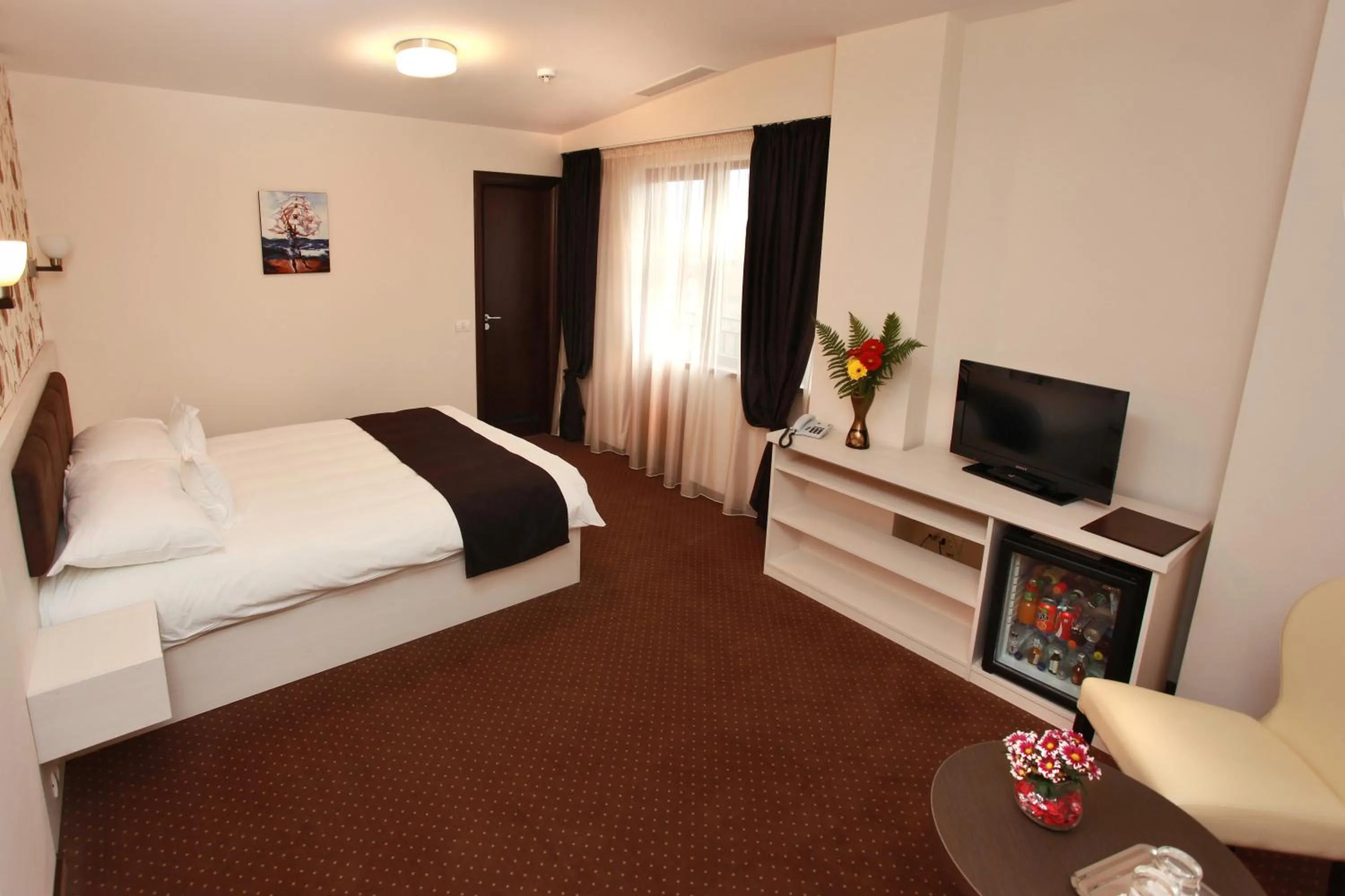 Bed in West Plaza Hotel