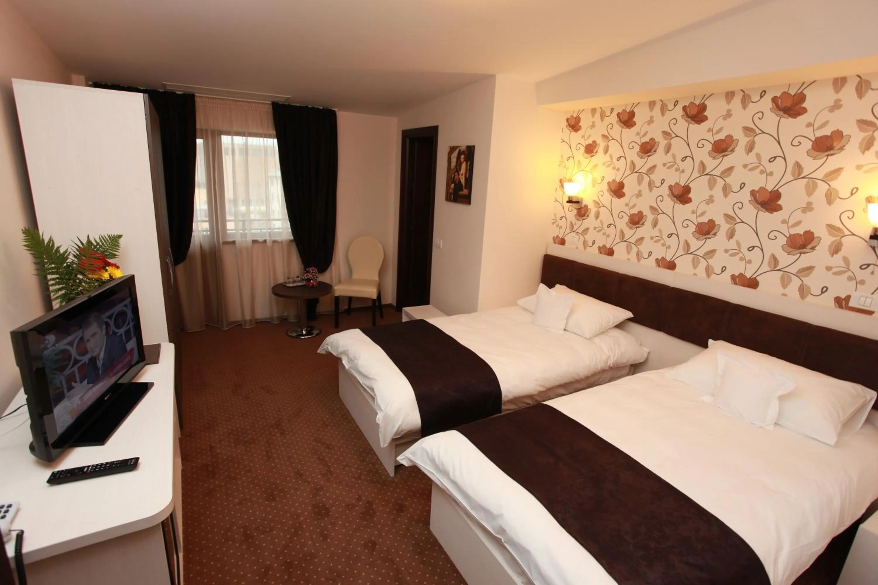 Bed in West Plaza Hotel