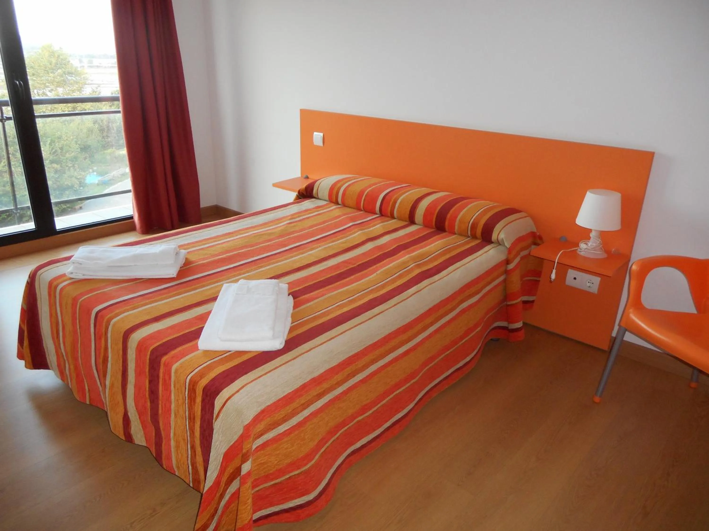 Bedroom, Bed in Apartamentos Bahía de Boó