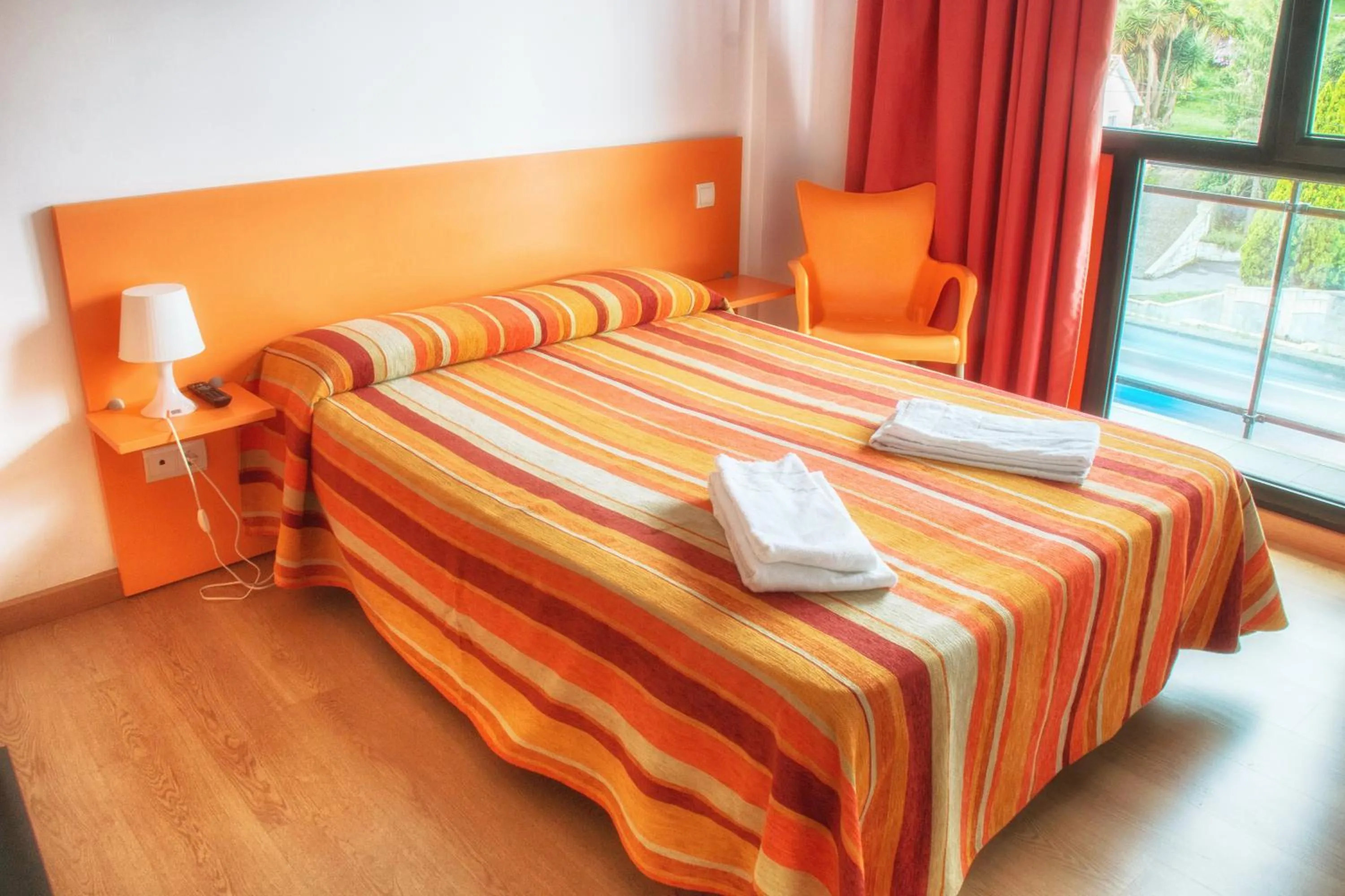 Bedroom, Bed in Apartamentos Bahía de Boó