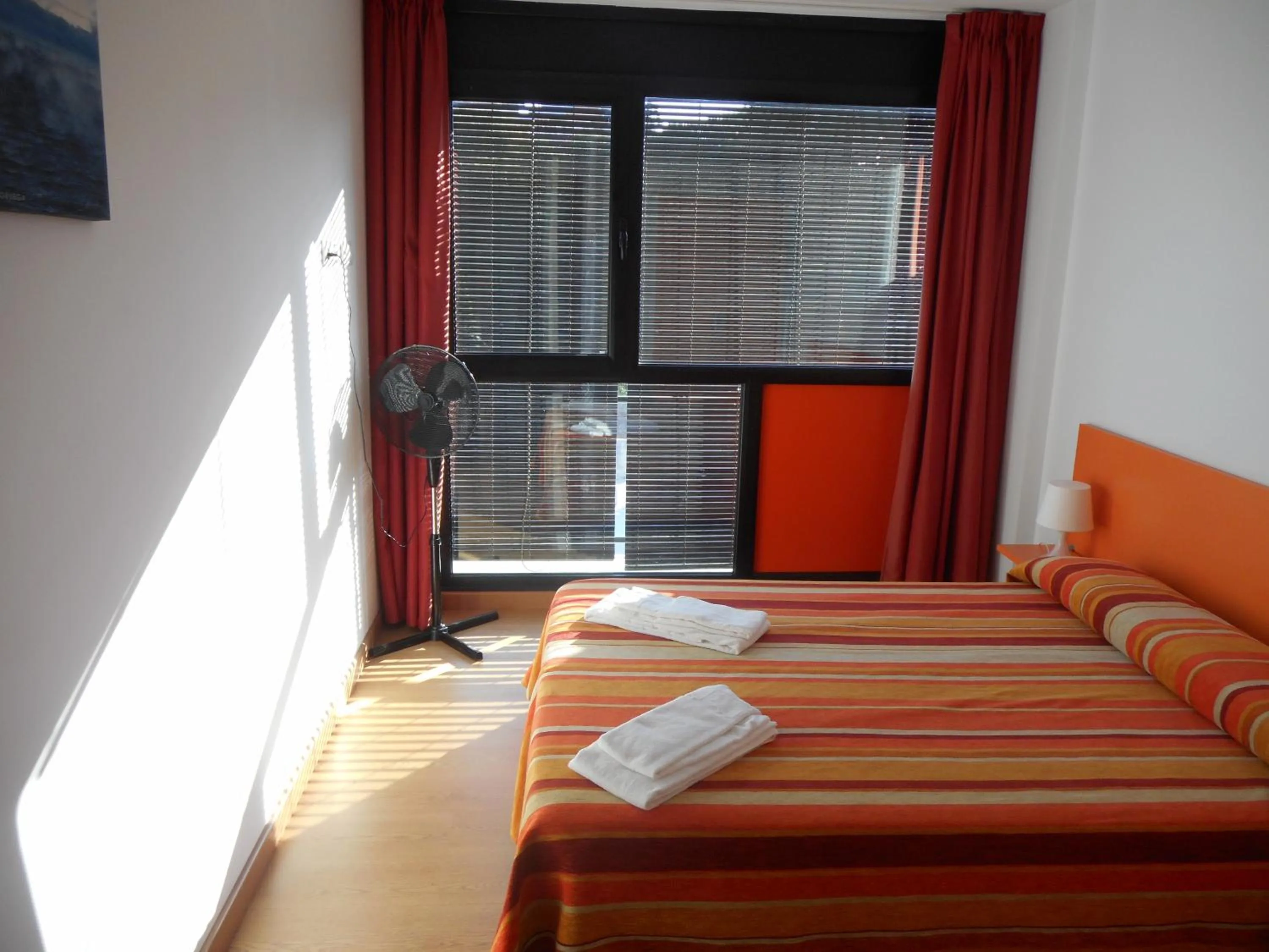 Bedroom, Bed in Apartamentos Bahía de Boó