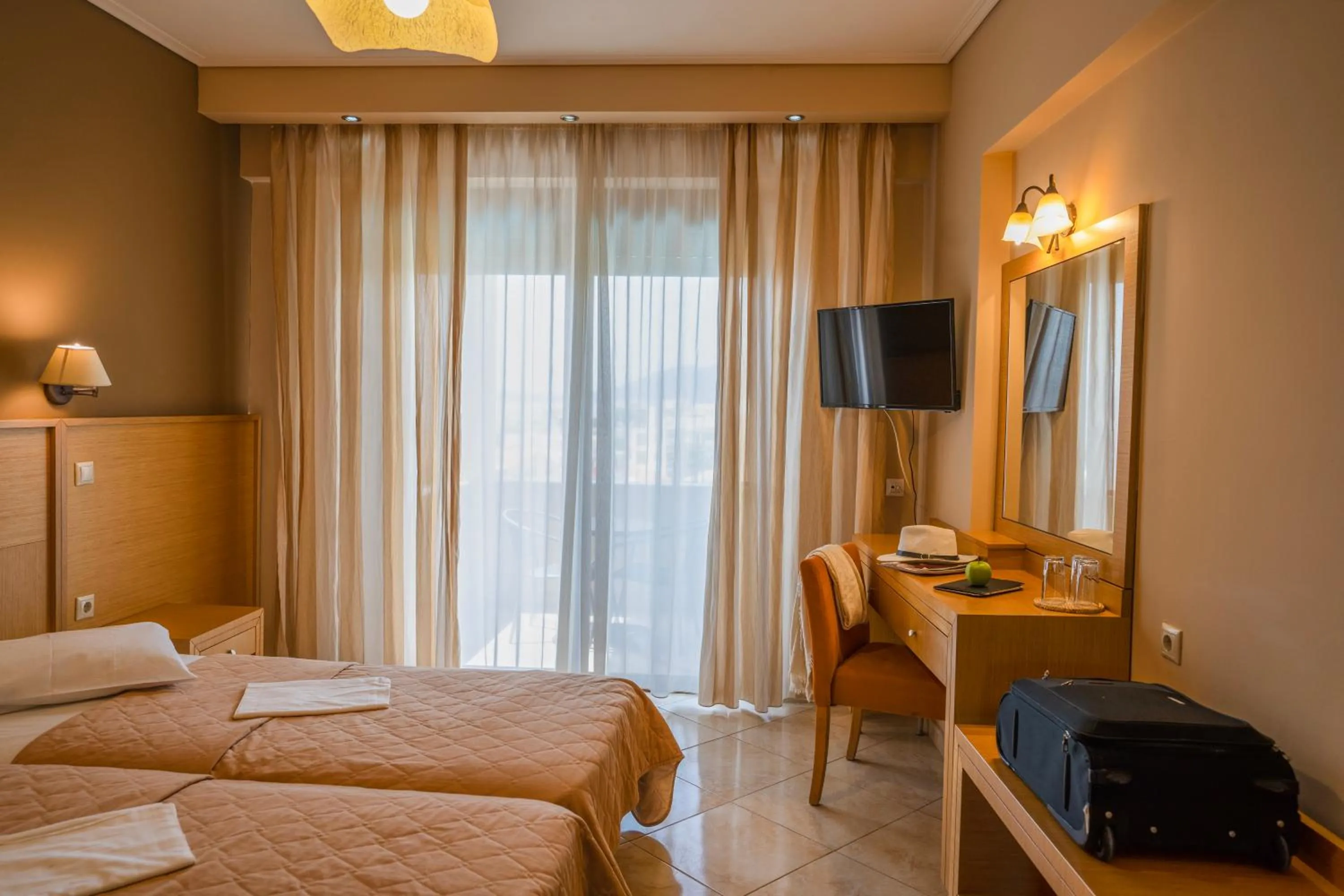 Bed in Evia Hotel & Suites