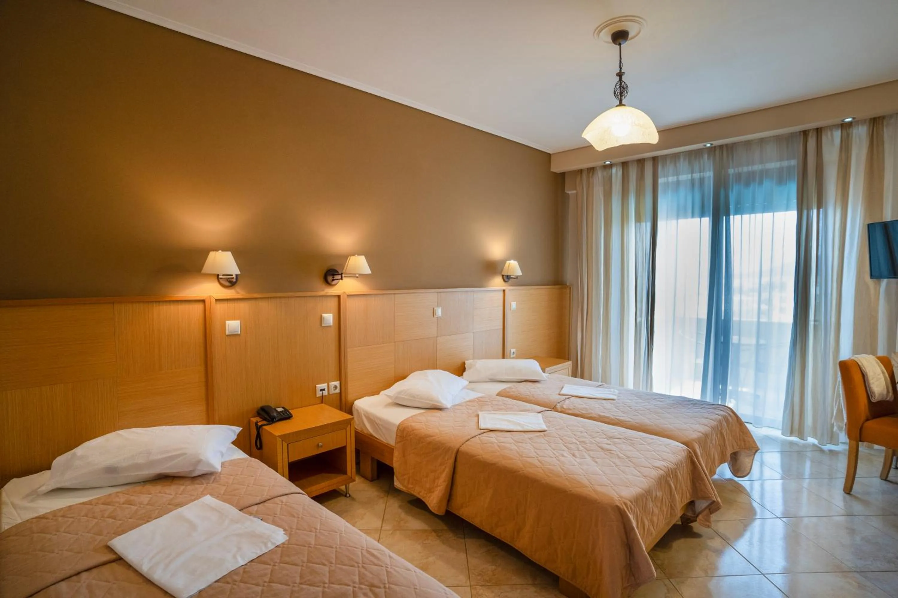 Bed in Evia Hotel & Suites