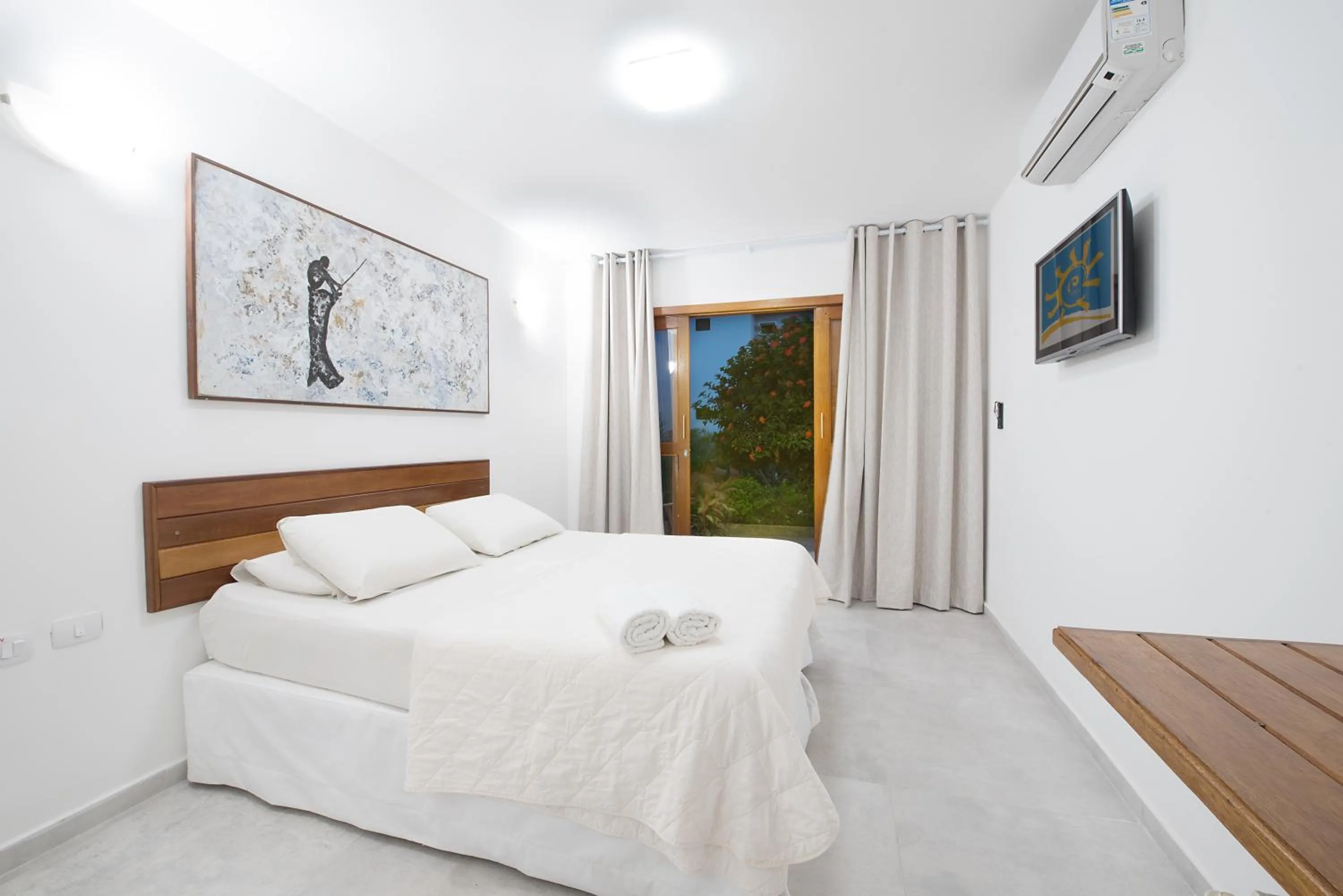 Bed in Pousada Quatro Estações