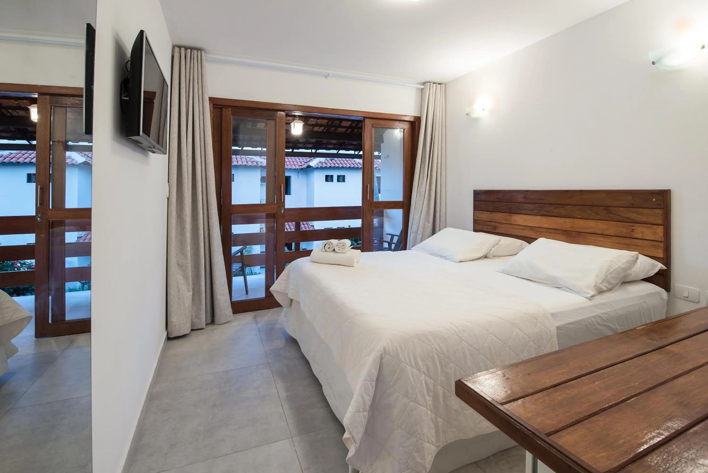 Bed in Pousada Quatro Estações