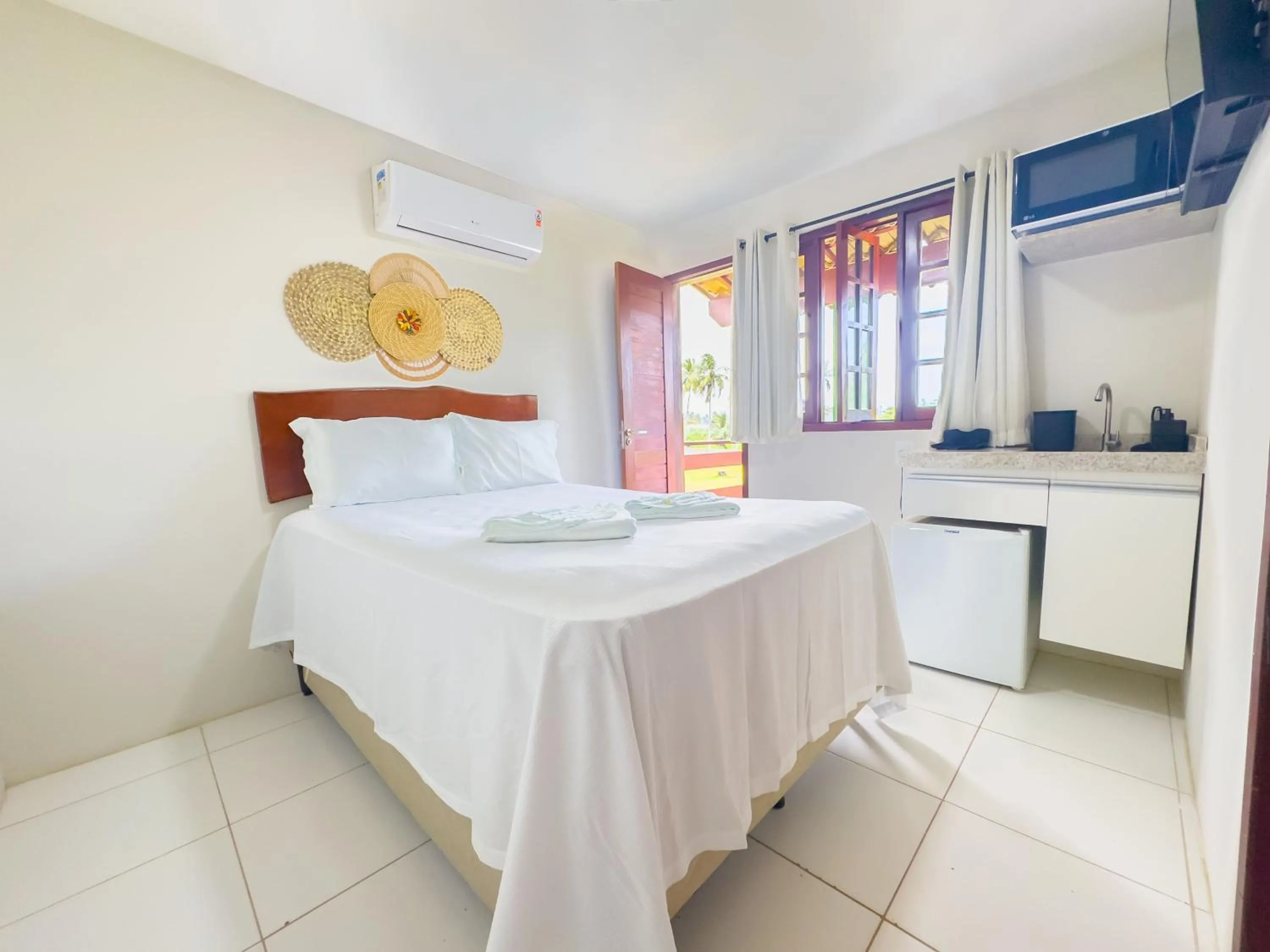 Kitchen or kitchenette, Bed in Chales Maragogi