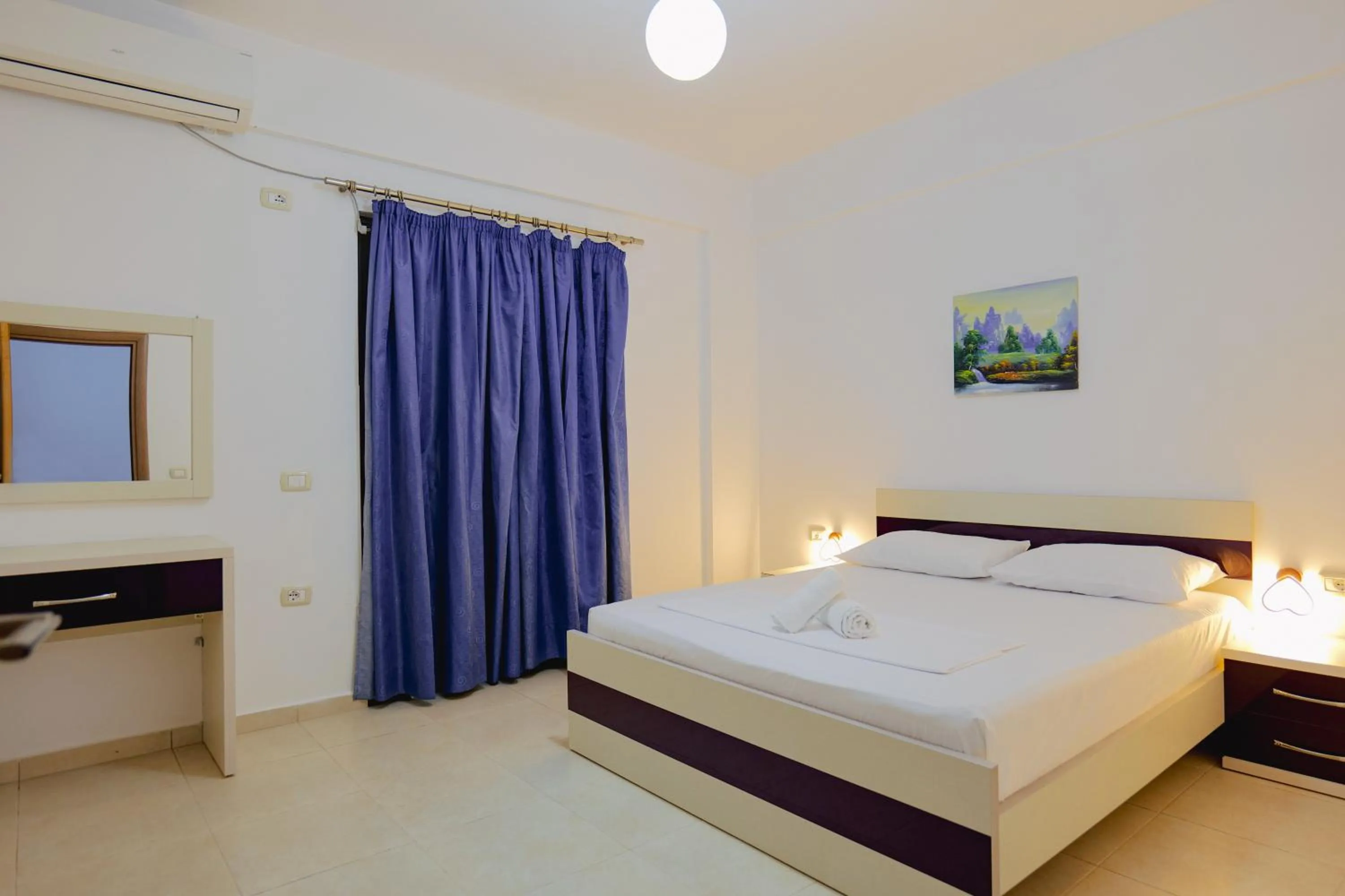 Bed in Hotel Argjiro