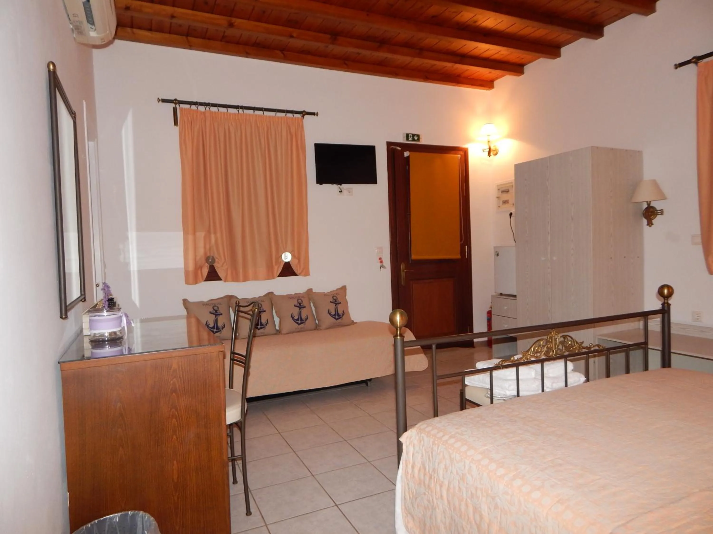 Bed in Tinos Suites & Apartments