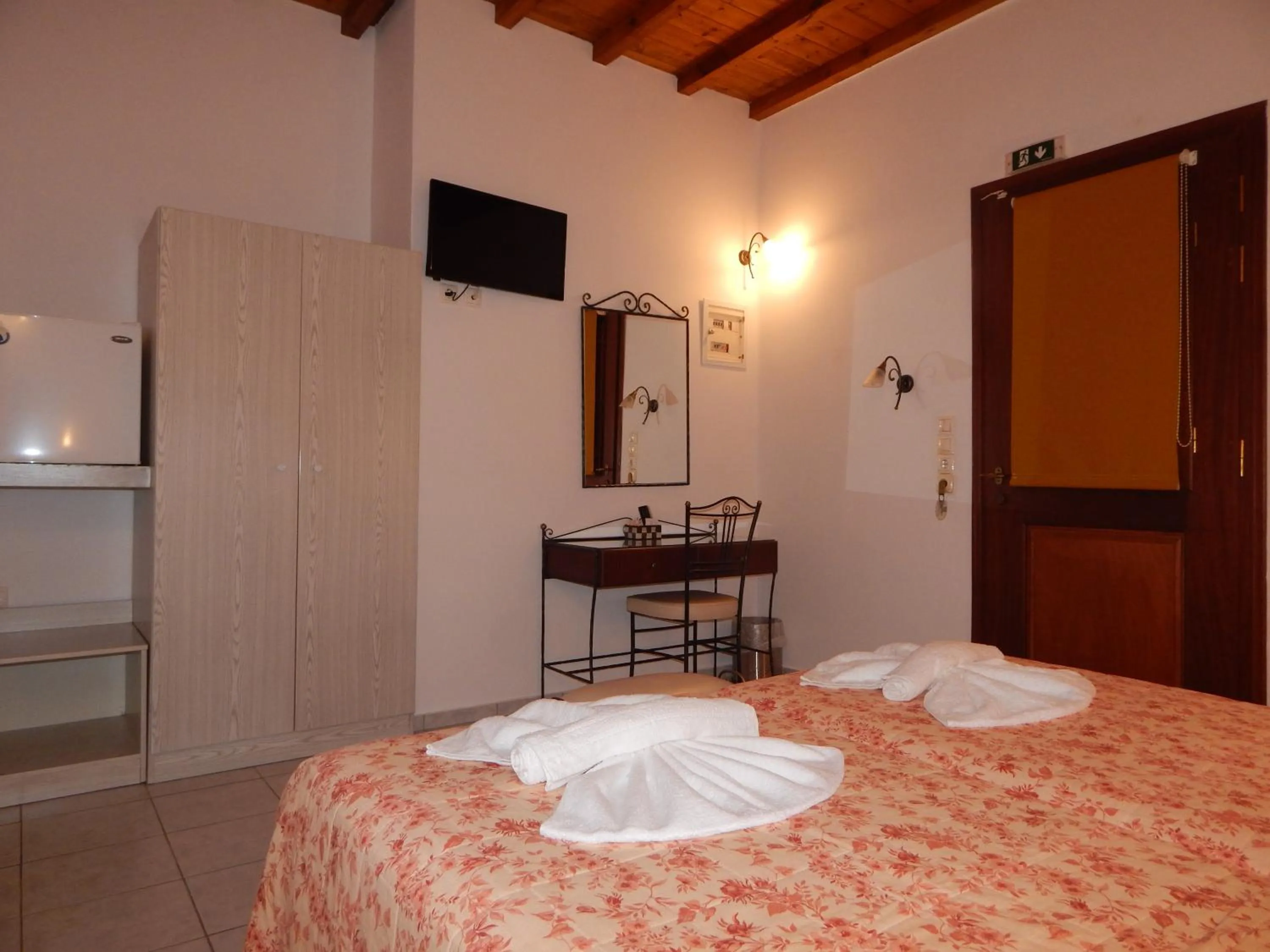 Bed in Tinos Suites & Apartments