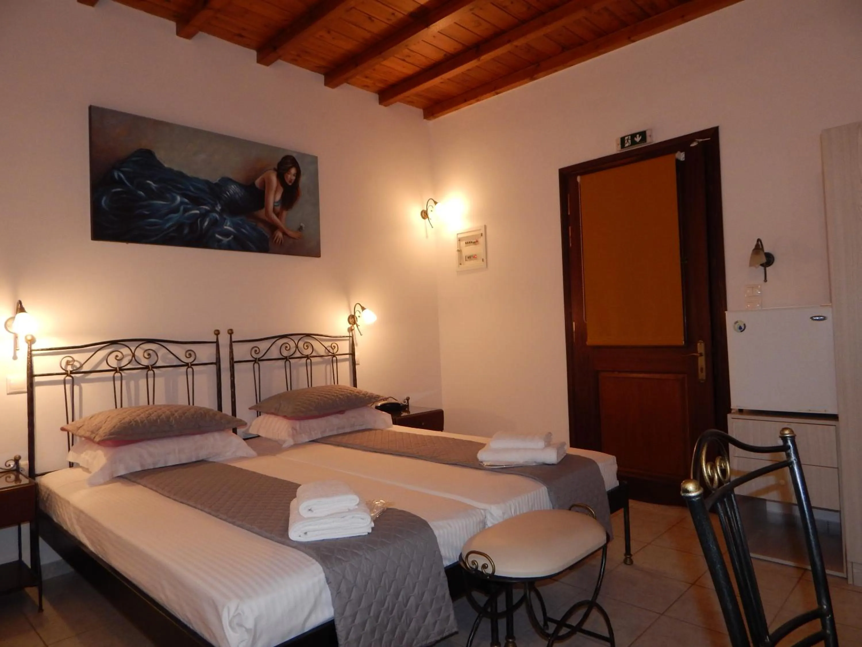 Bed in Tinos Suites & Apartments