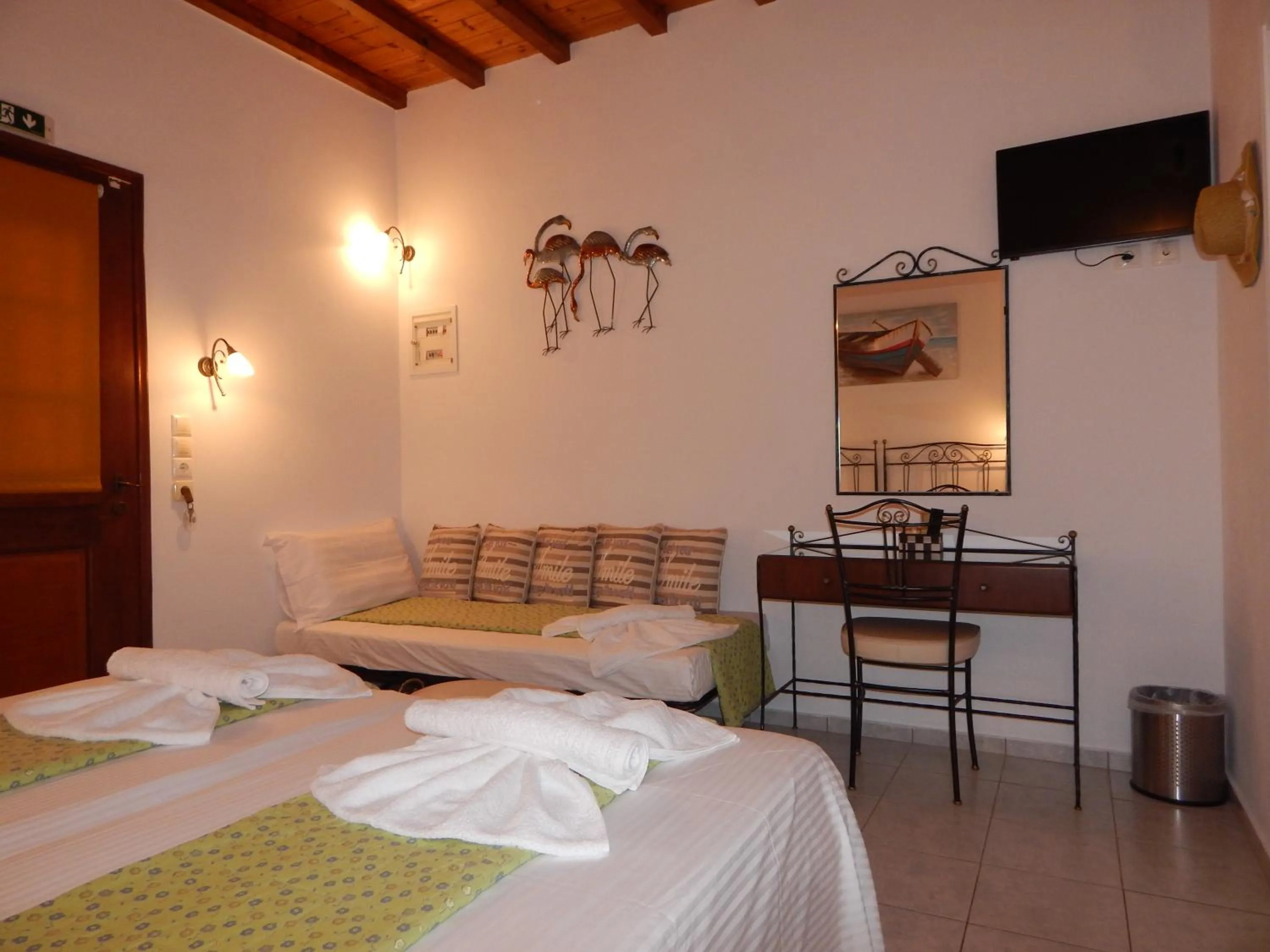 Bed in Tinos Suites & Apartments