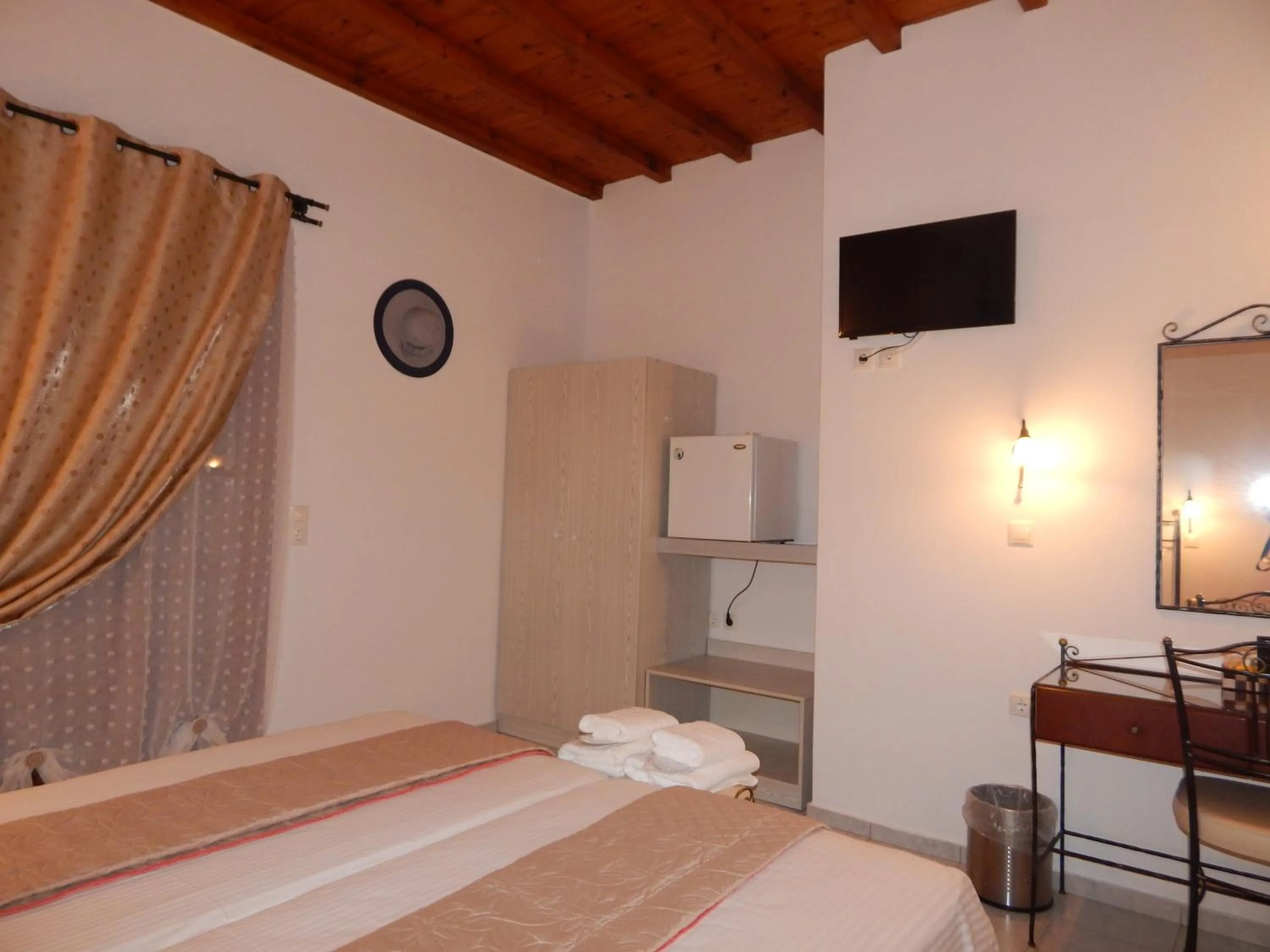 Bed in Tinos Suites & Apartments