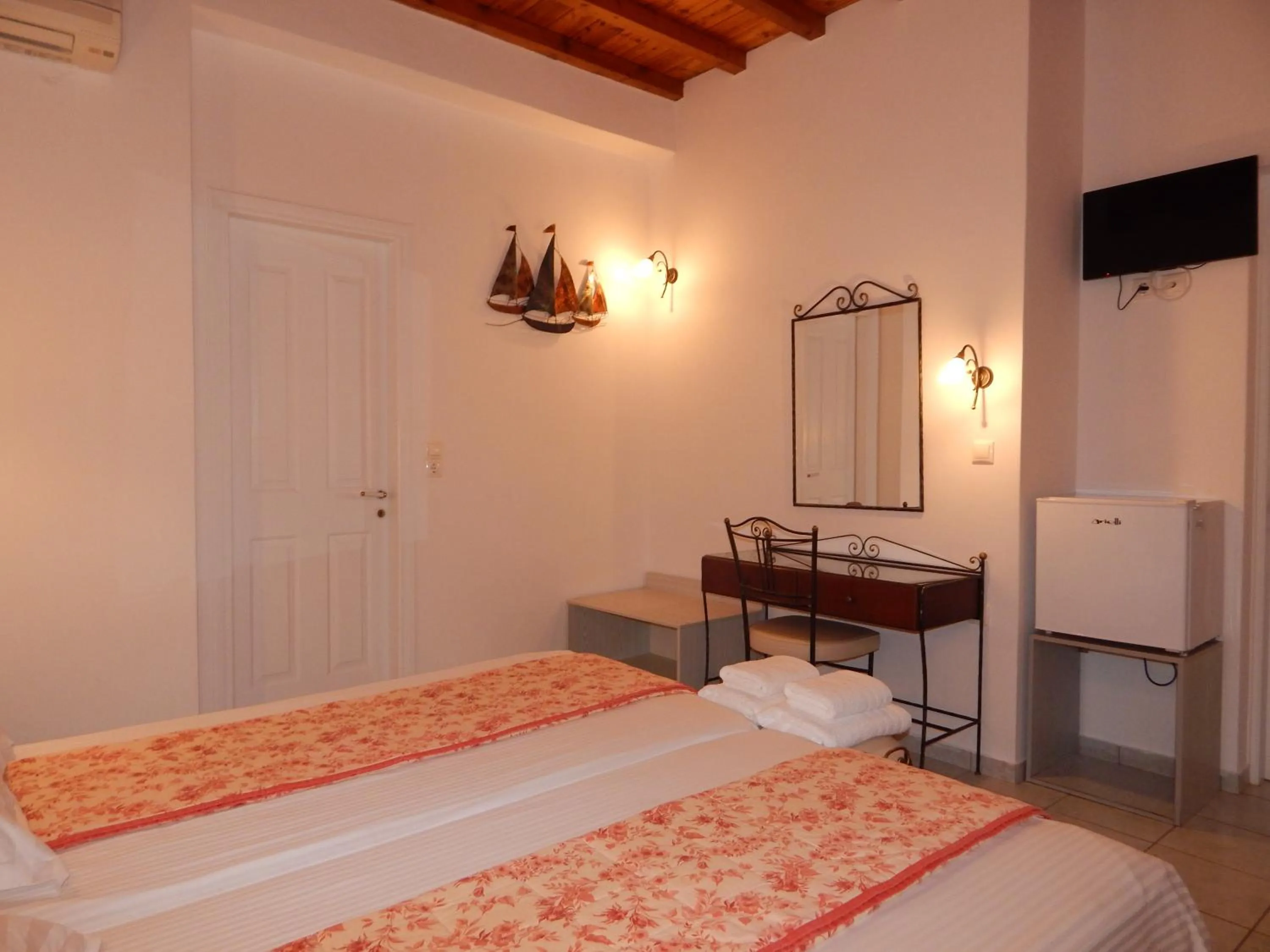 Bed in Tinos Suites & Apartments