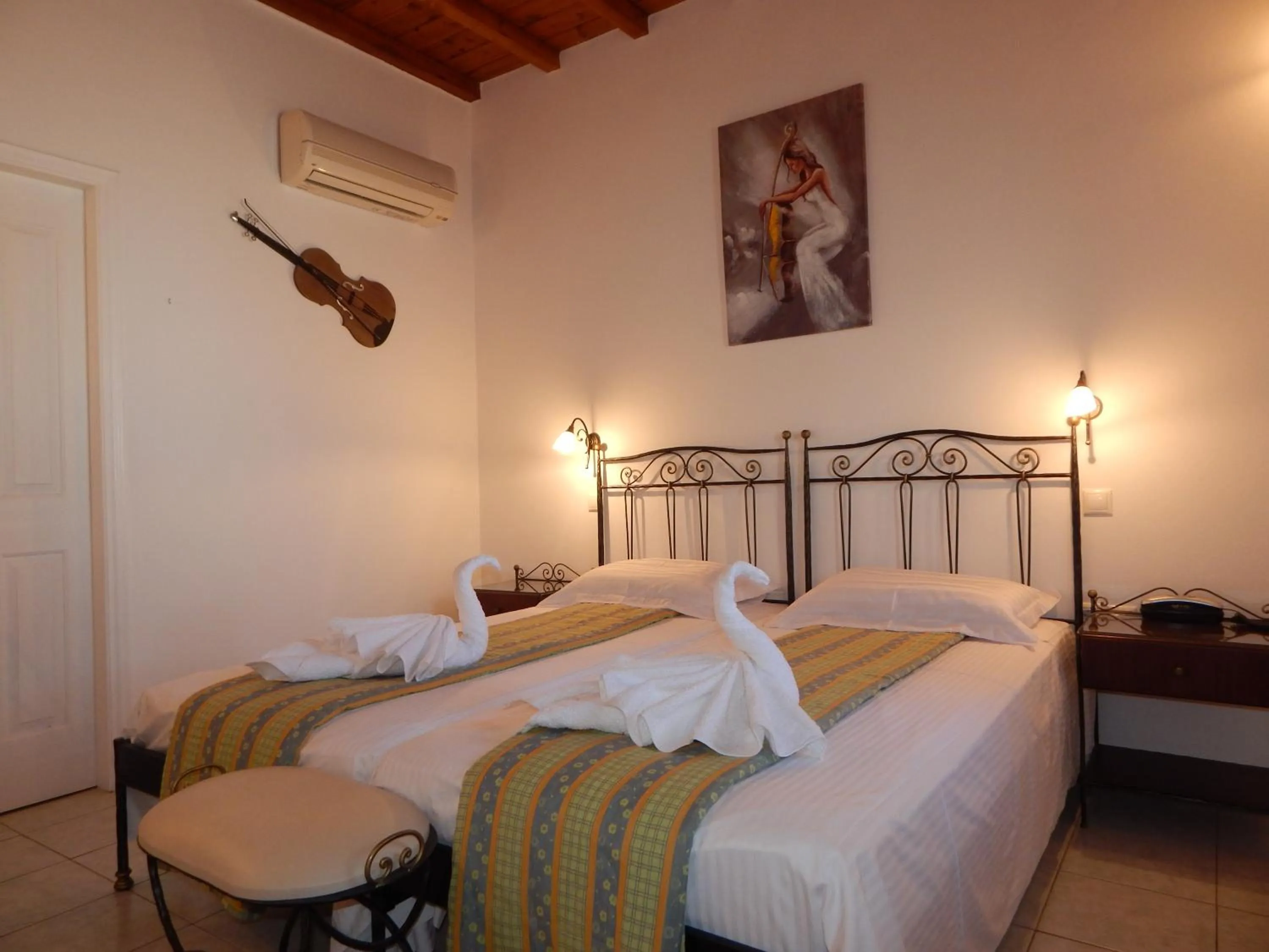 Bed in Tinos Suites & Apartments