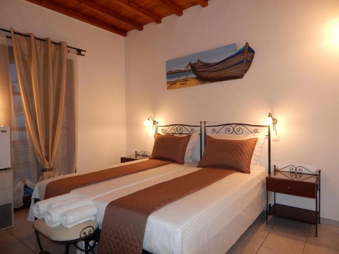 Bed in Tinos Suites & Apartments