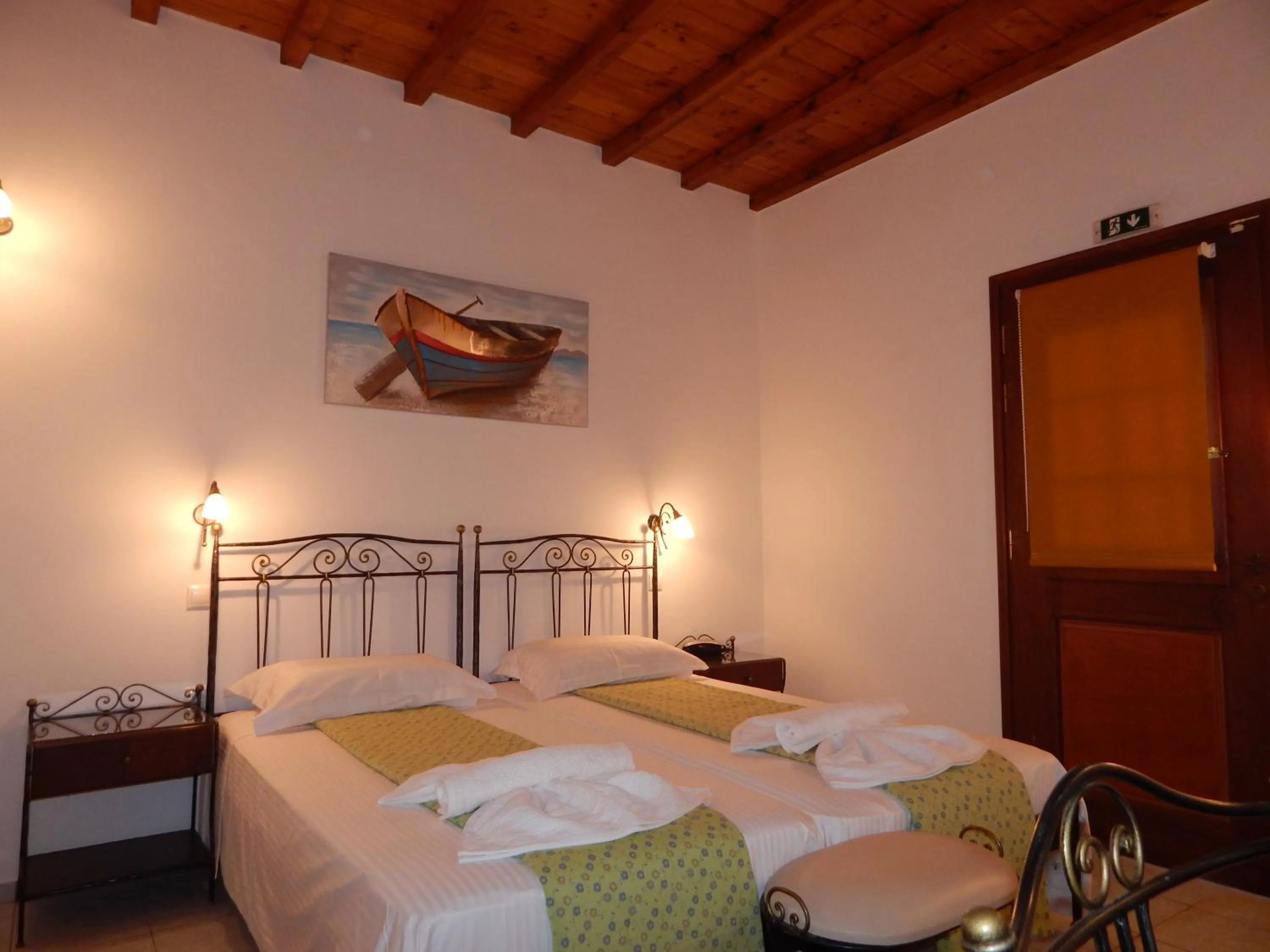 Bed in Tinos Suites & Apartments