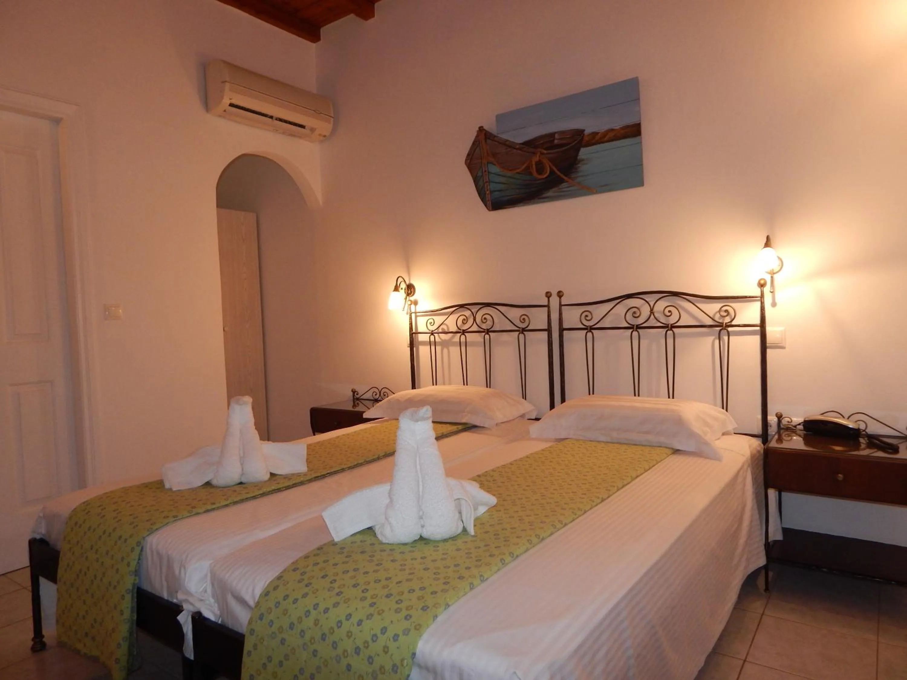 Bed in Tinos Suites & Apartments