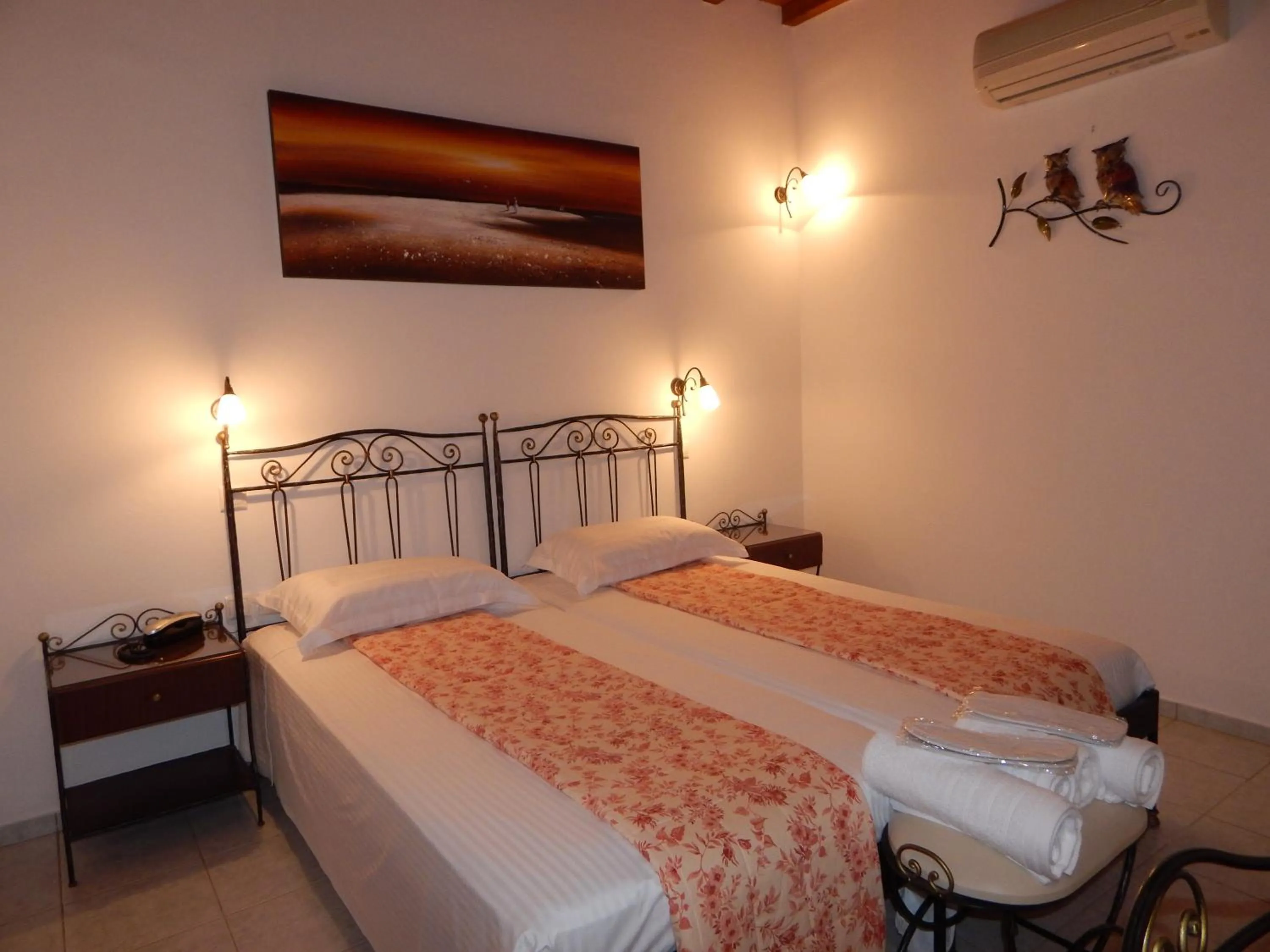 Bed in Tinos Suites & Apartments