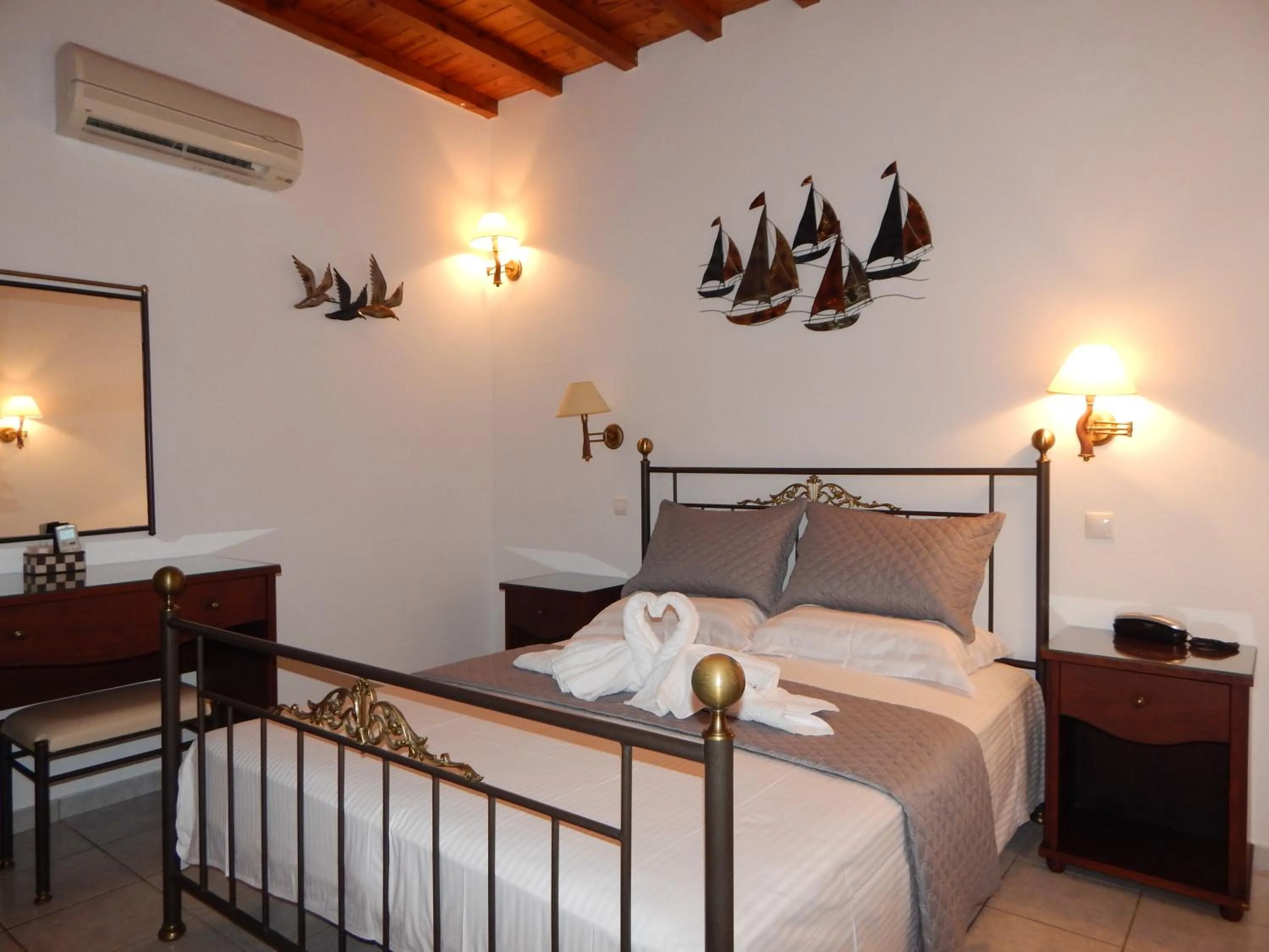 Bed in Tinos Suites & Apartments