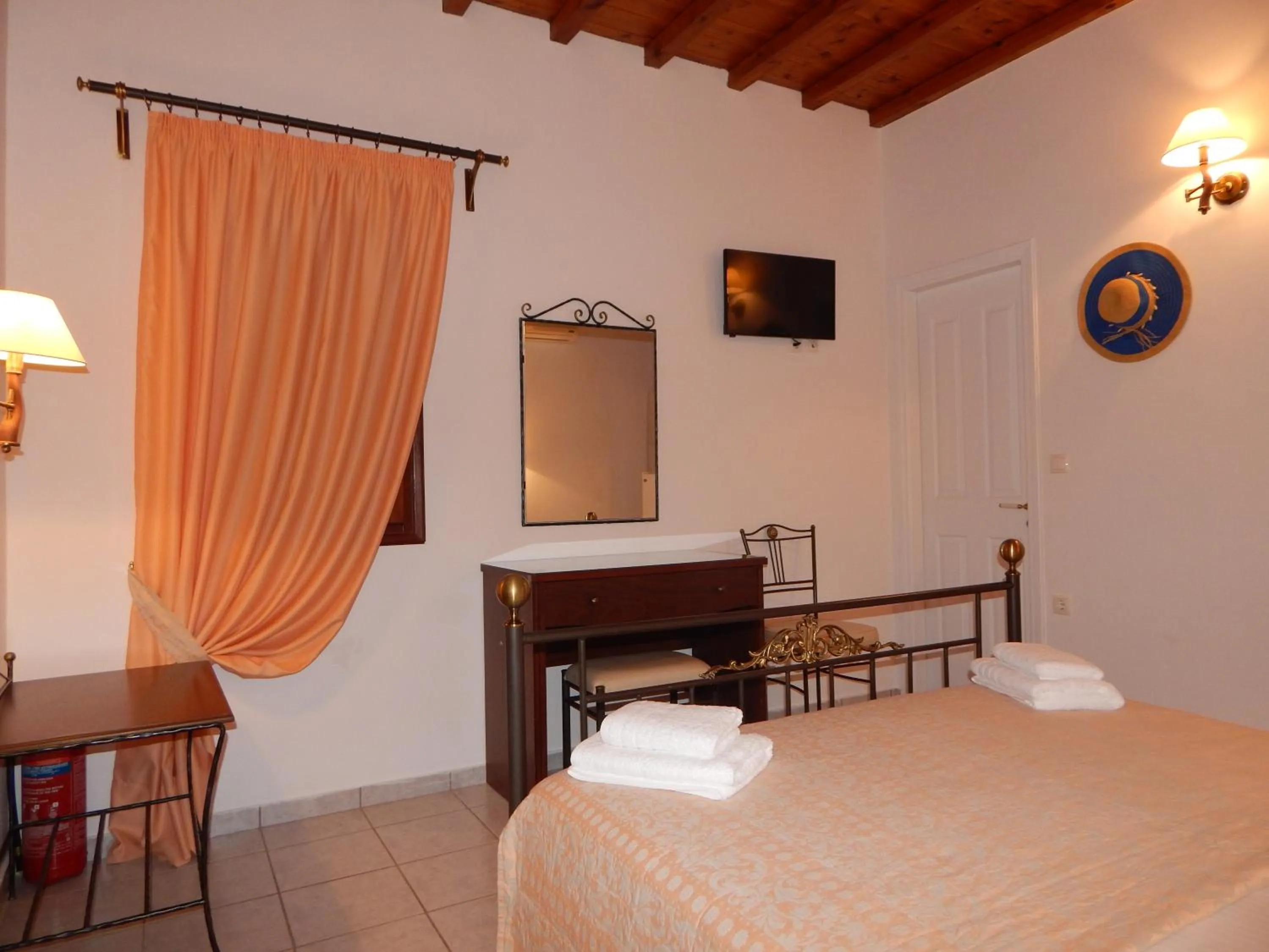 Bed in Tinos Suites & Apartments