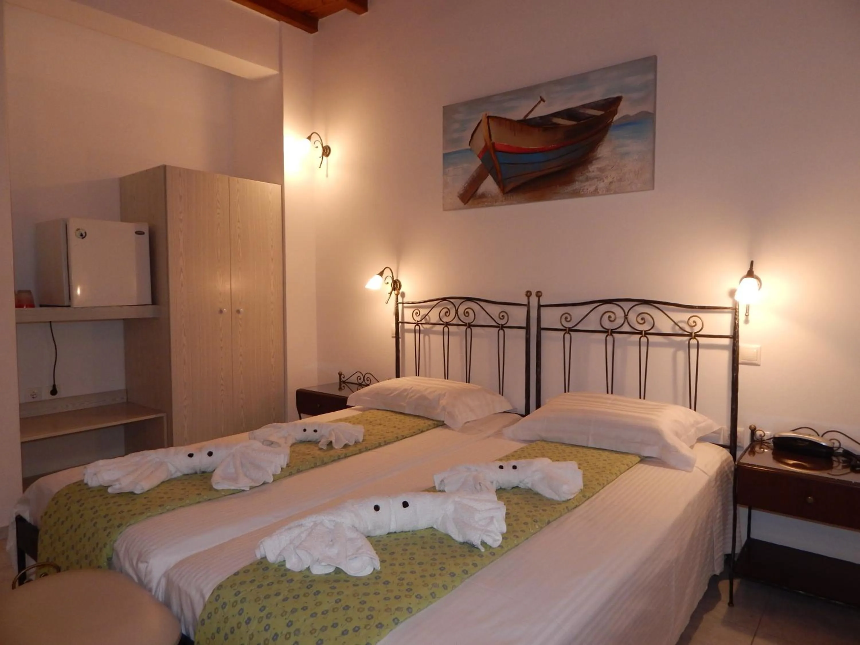 Bed in Tinos Suites & Apartments