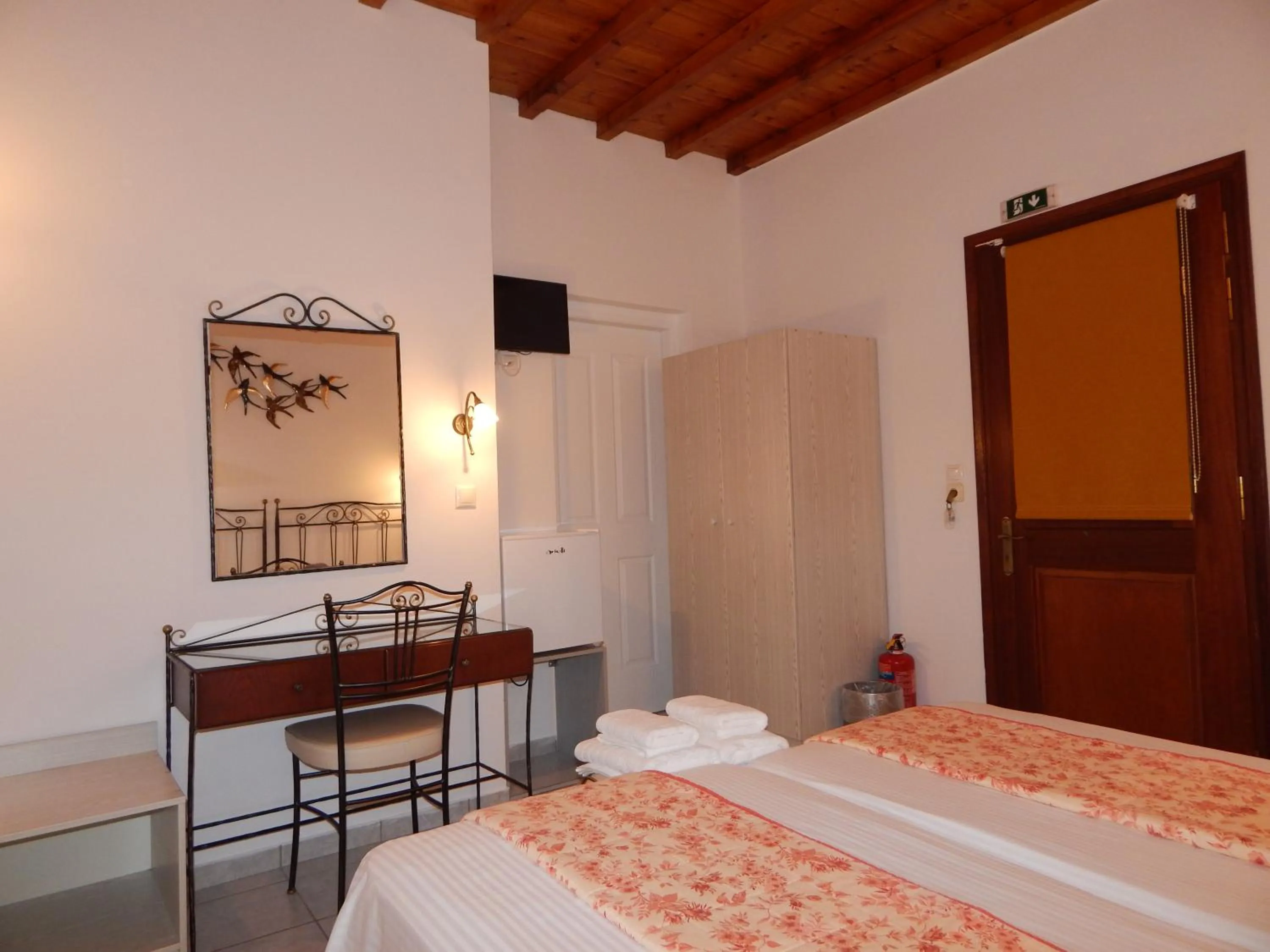 Bed in Tinos Suites & Apartments