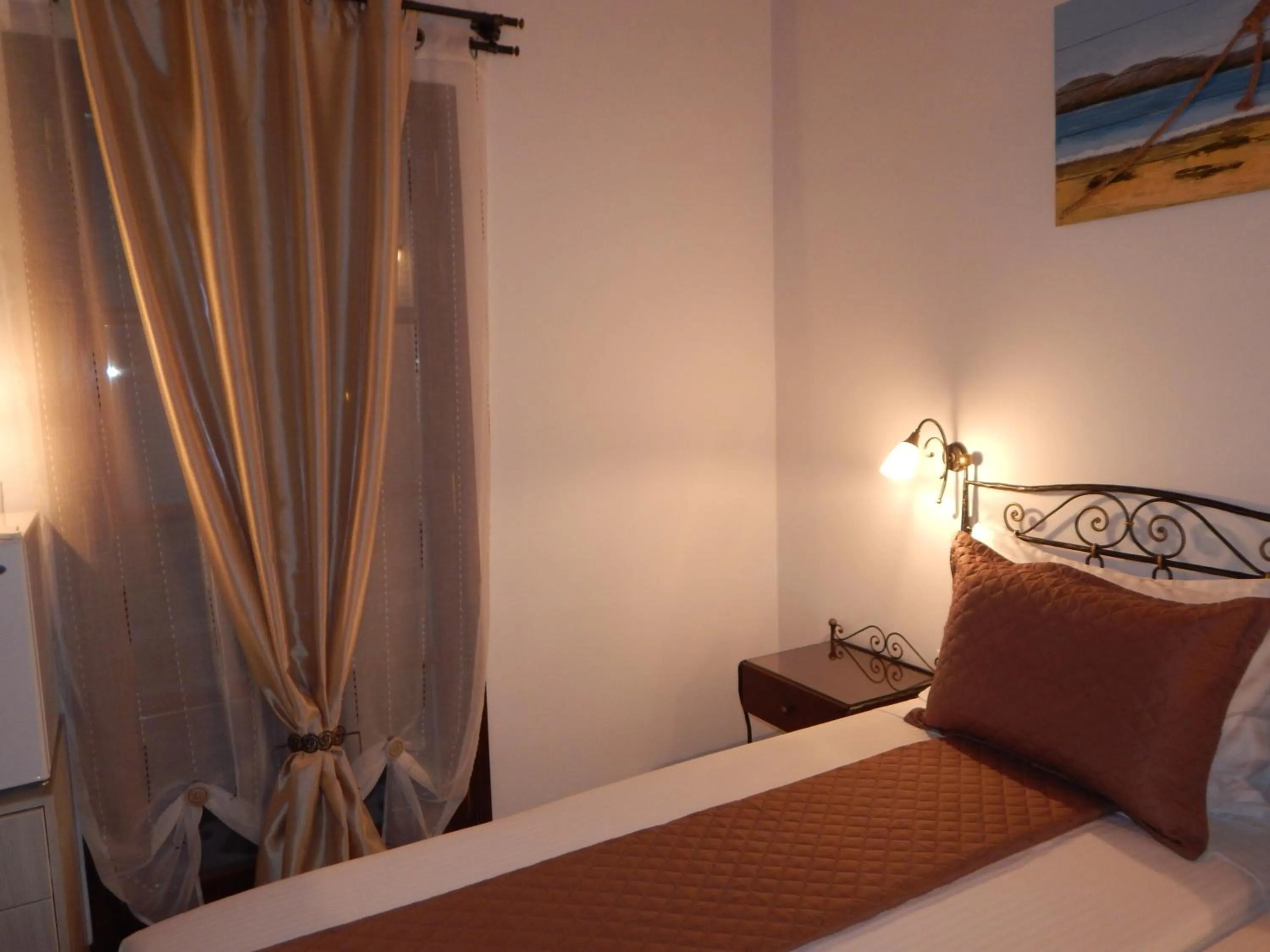 Bed in Tinos Suites & Apartments