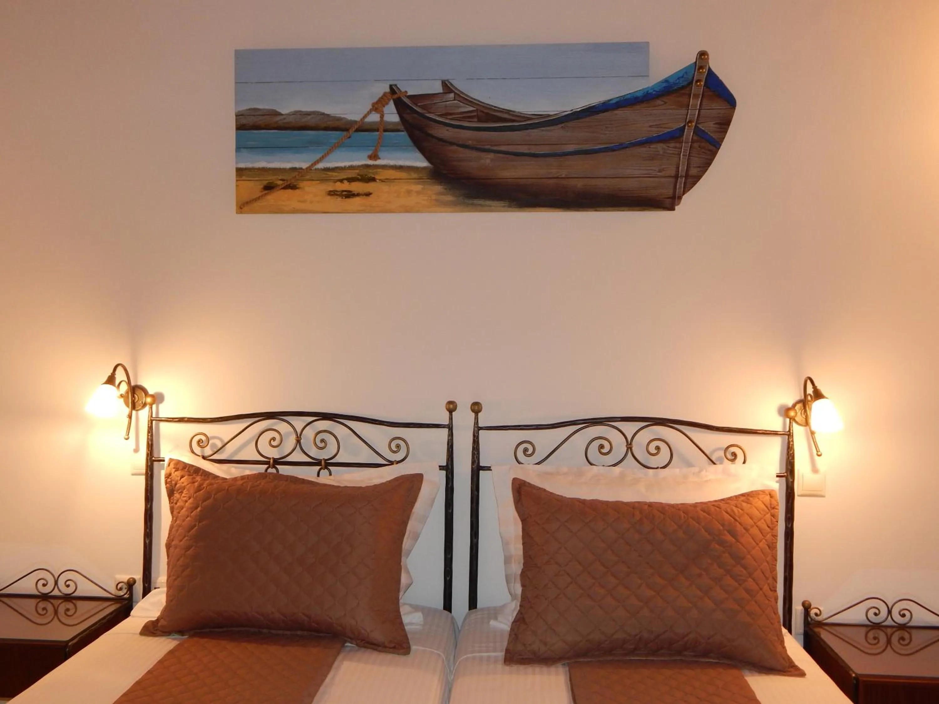 Bed in Tinos Suites & Apartments