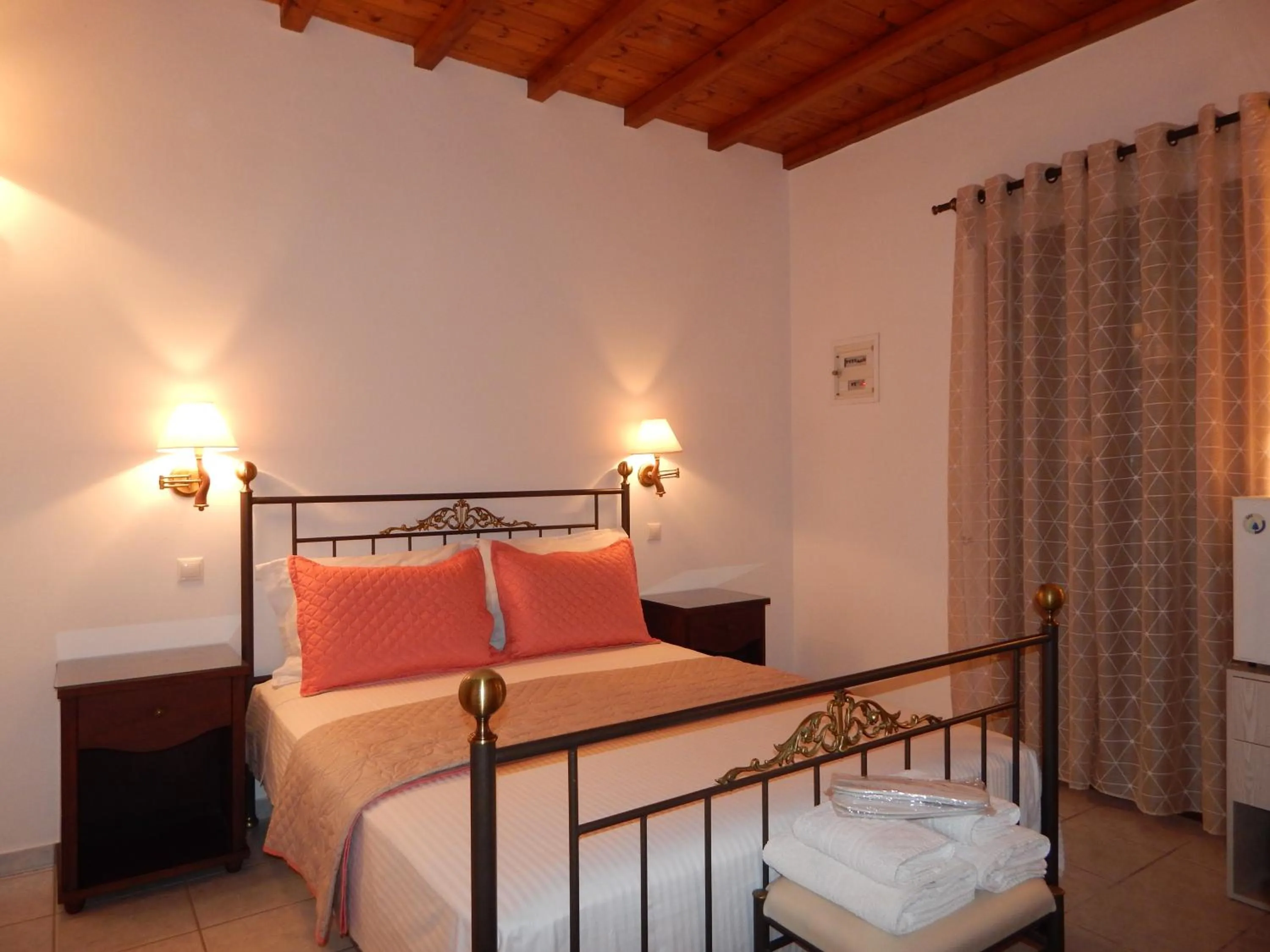 Bed in Tinos Suites & Apartments