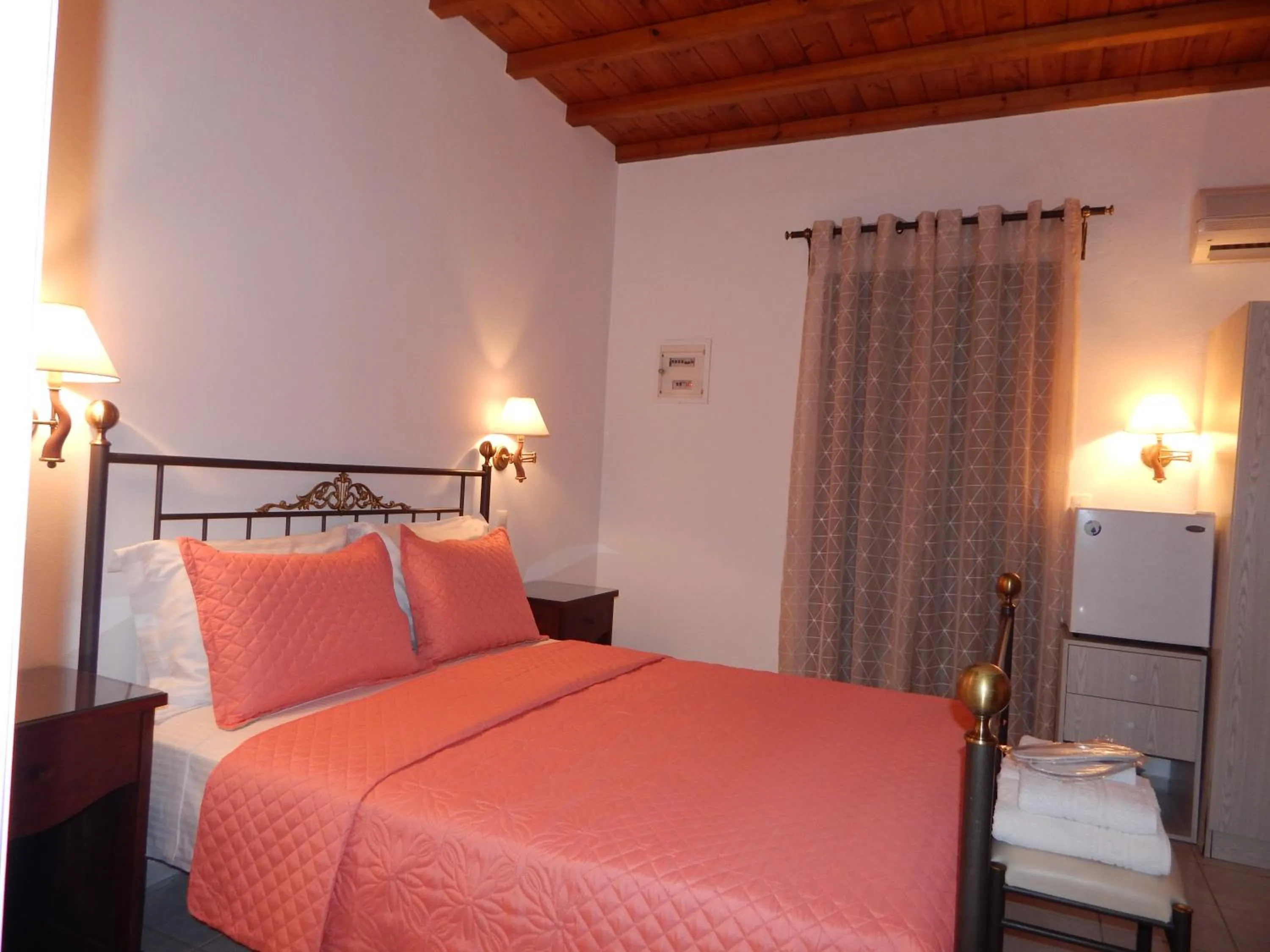 Bed in Tinos Suites & Apartments
