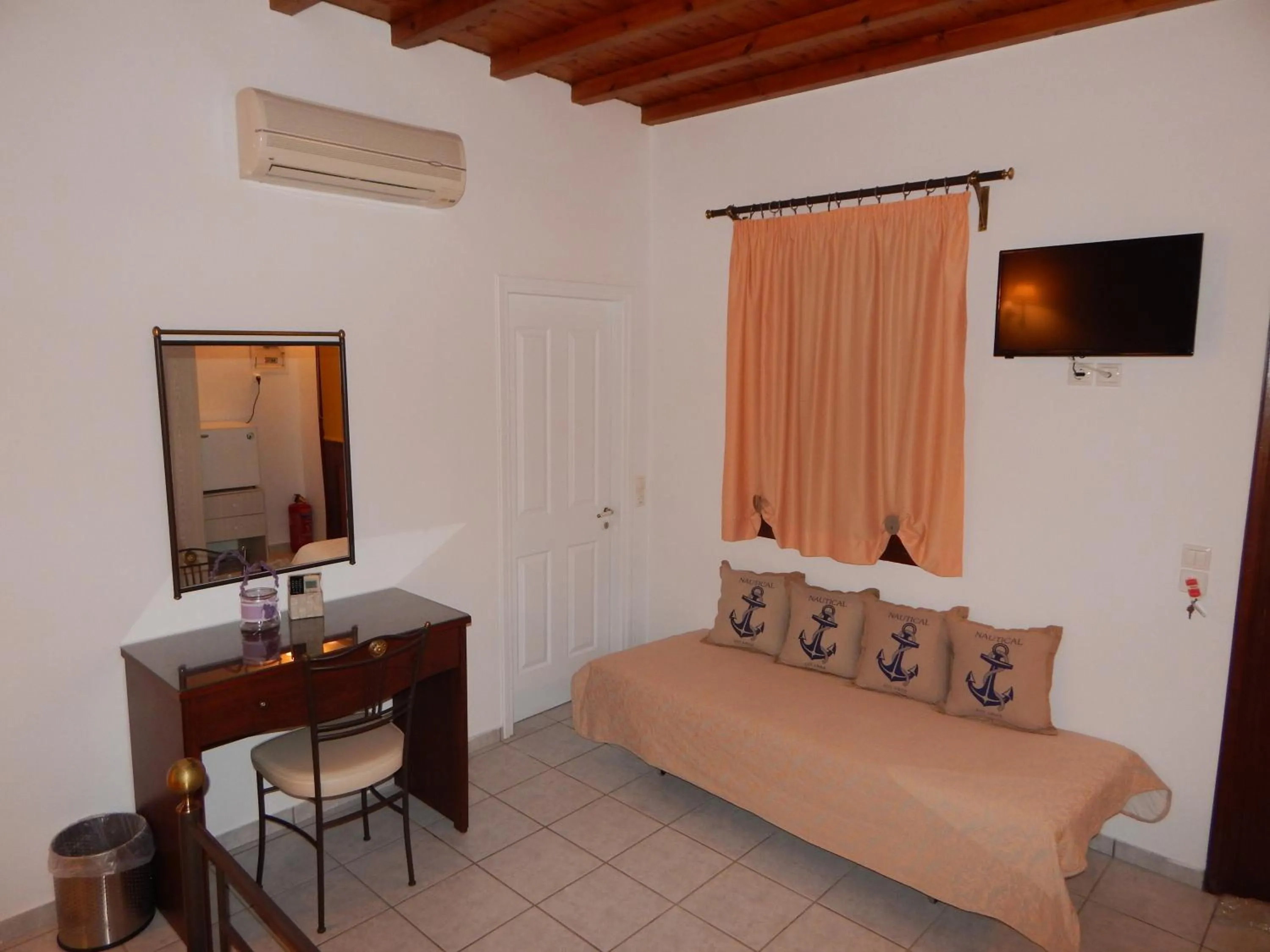 Bed in Tinos Suites & Apartments