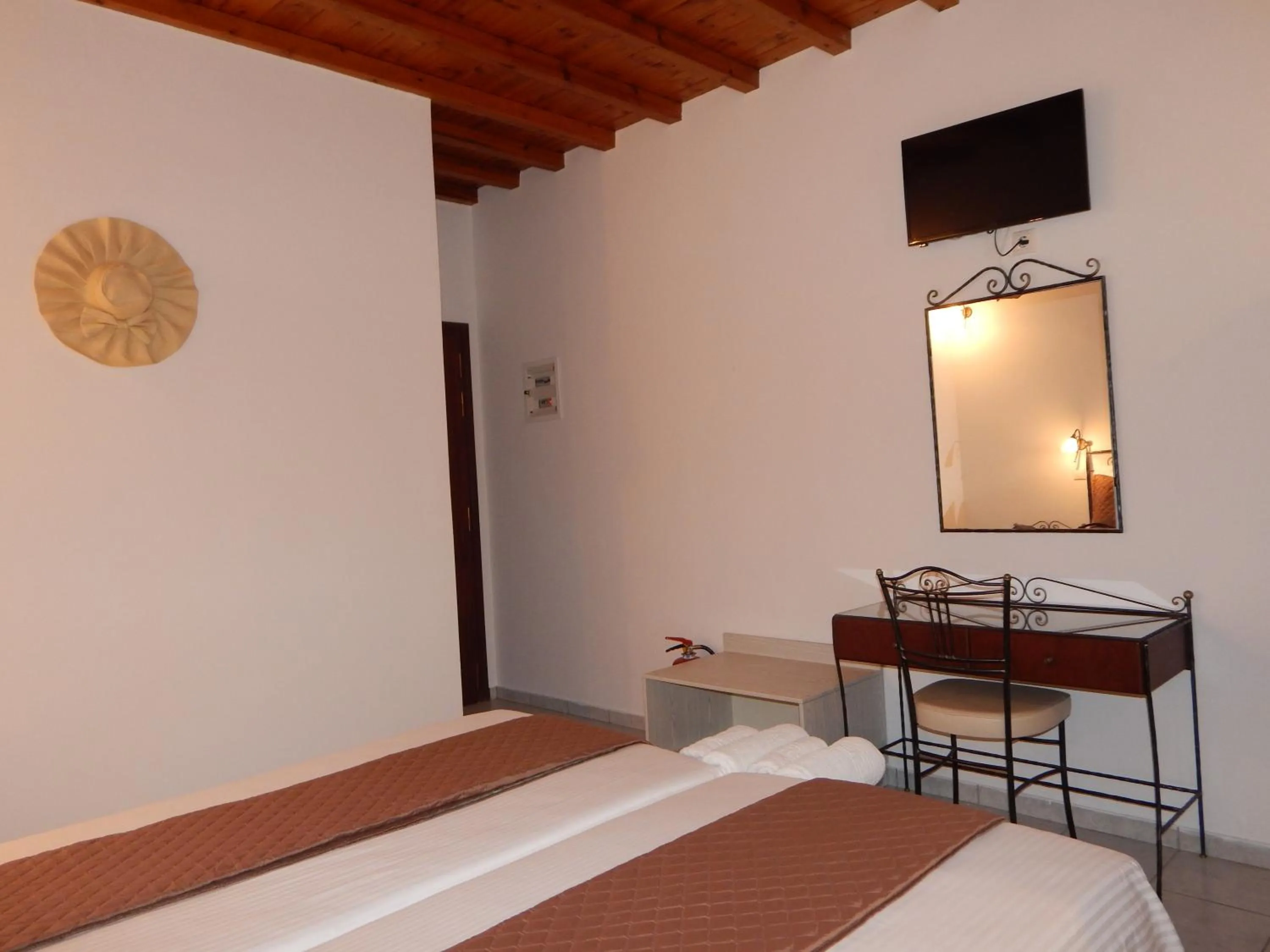 Bed in Tinos Suites & Apartments
