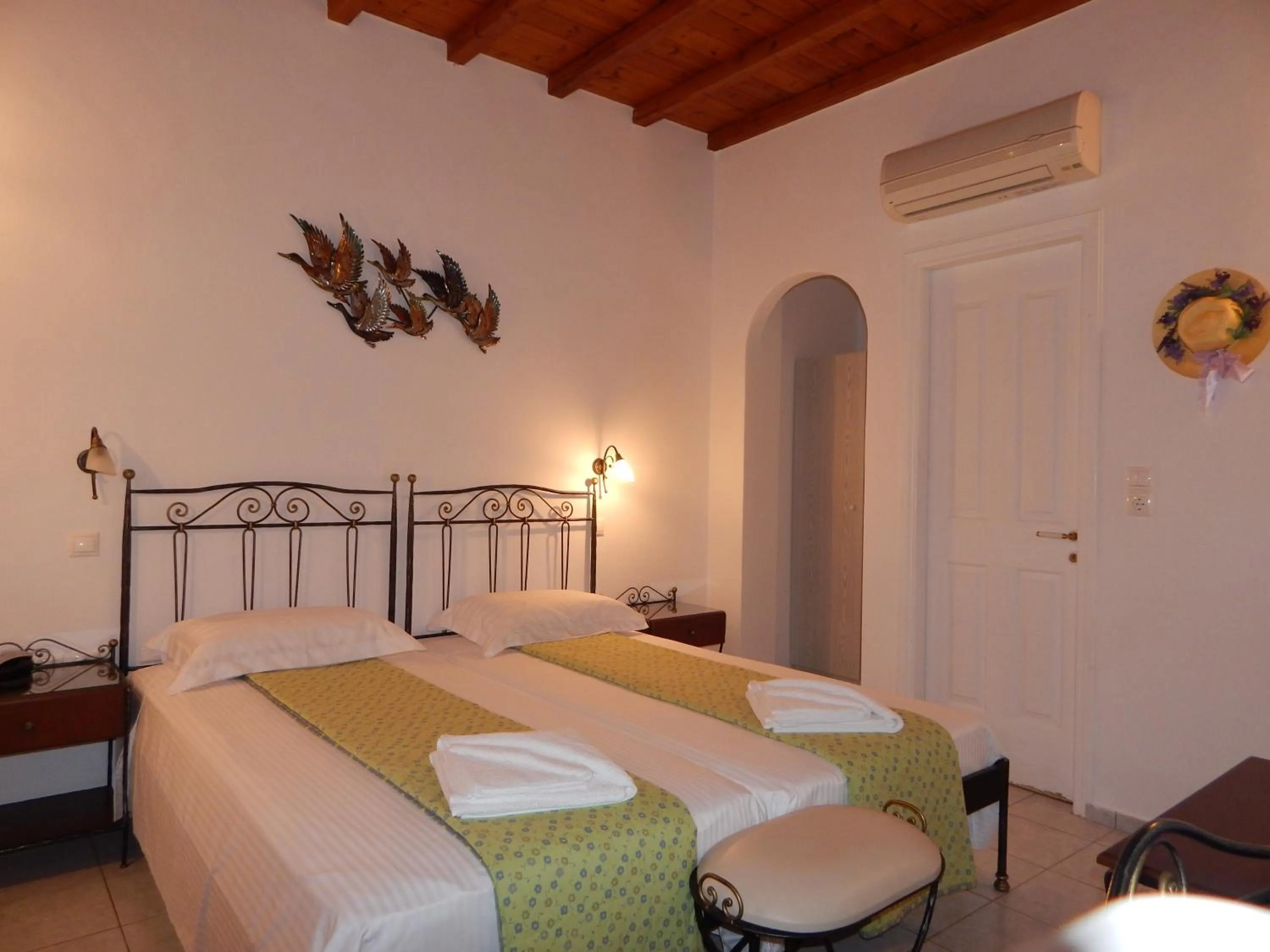 Bed in Tinos Suites & Apartments