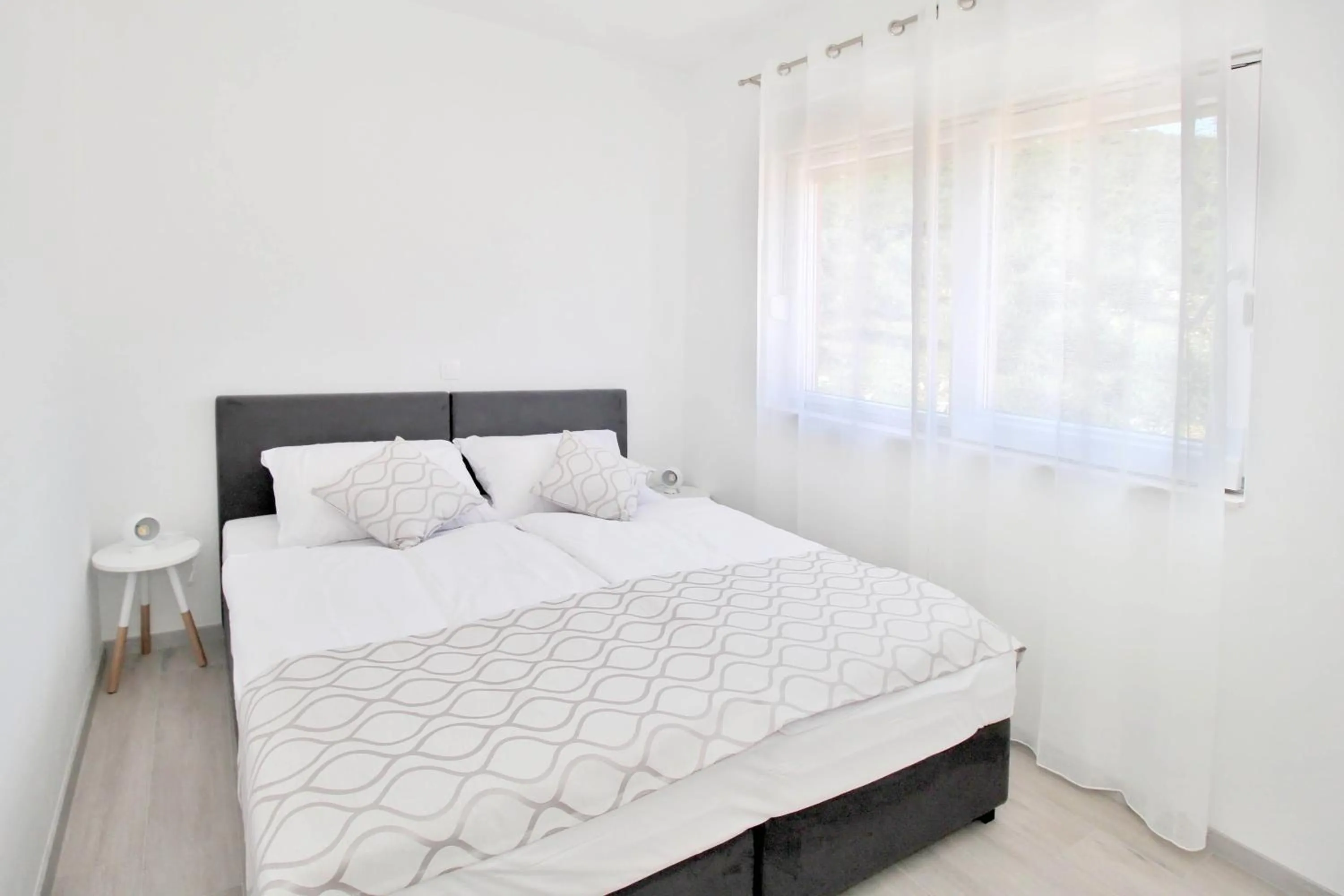 Bed in Bacan Family Apartments