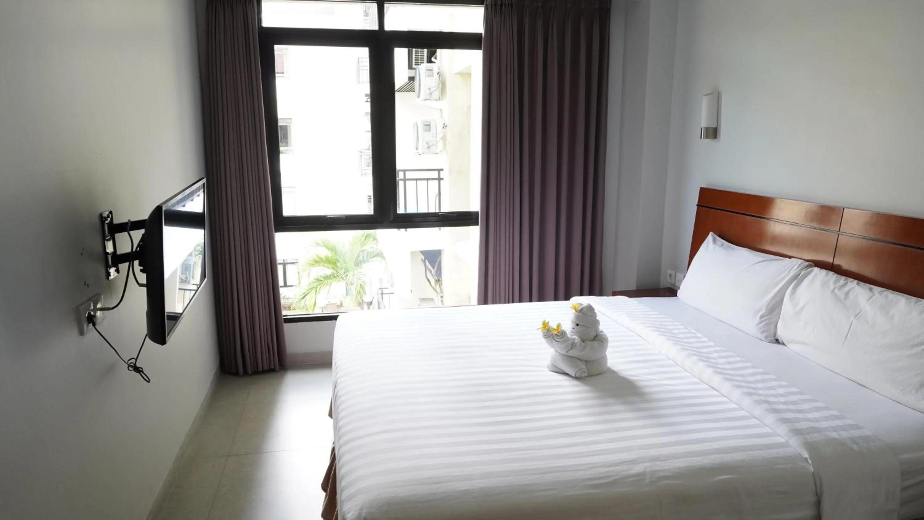 Property building, Bed in Grand Kuta Hotel and Residence