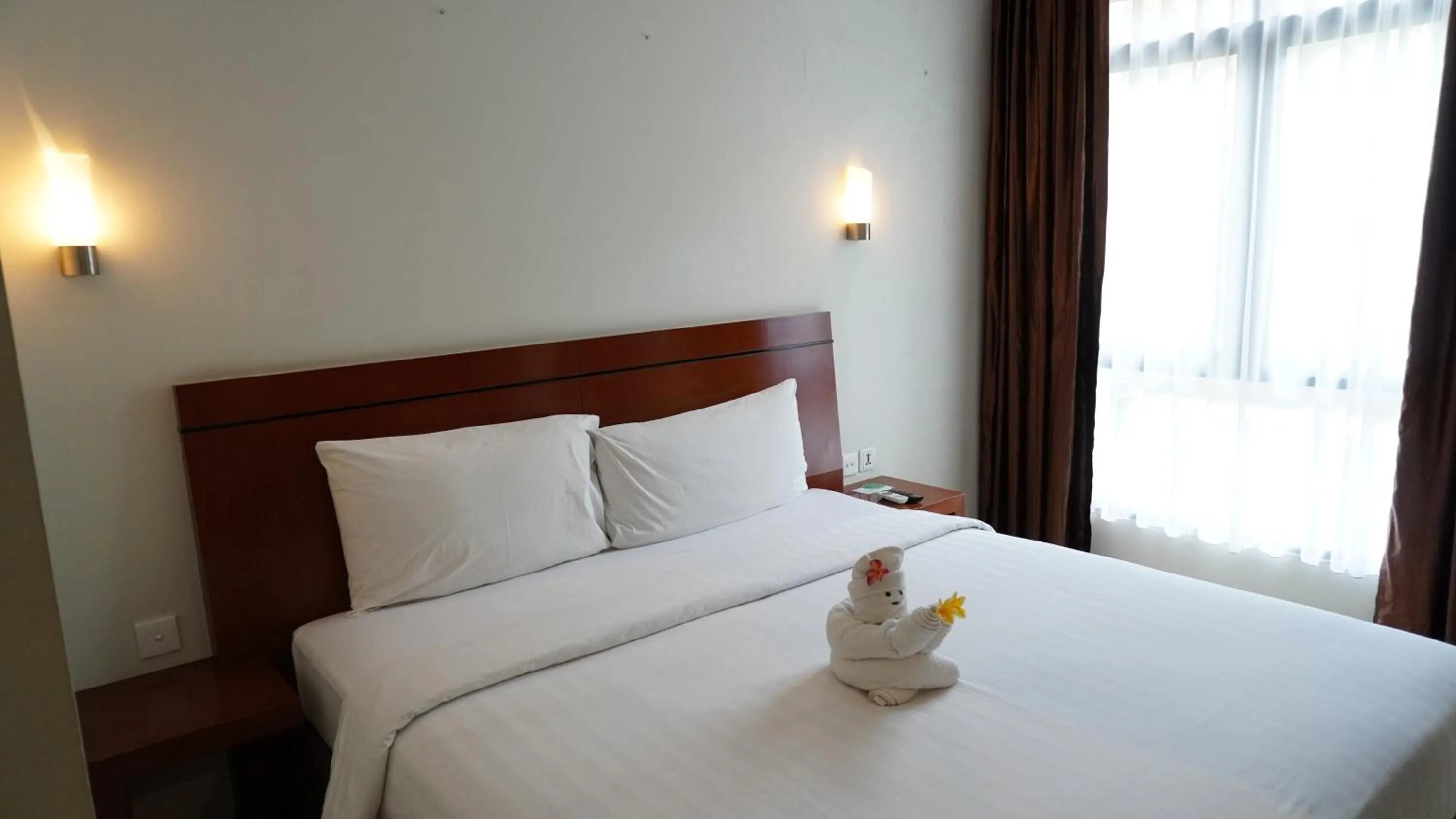 Property building, Bed in Grand Kuta Hotel and Residence