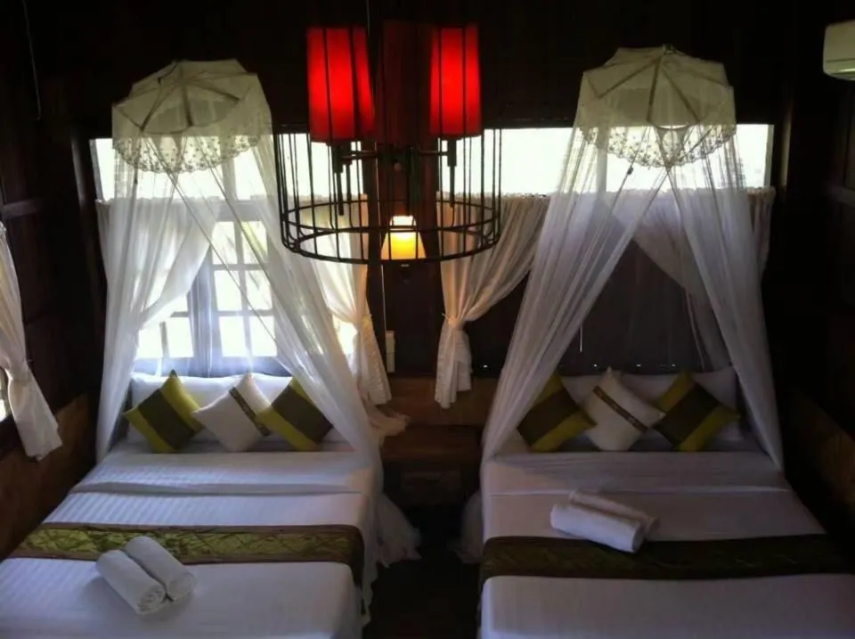 Bed in Vimarnkiri Resort