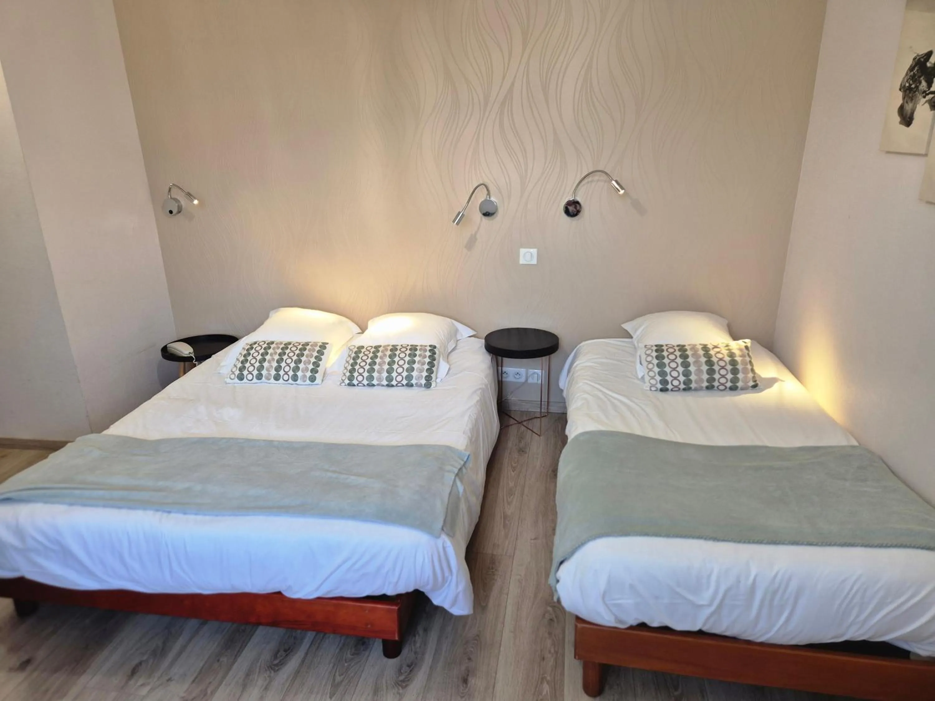 Bed in Logis Hôtel Restaurant L'Oustal