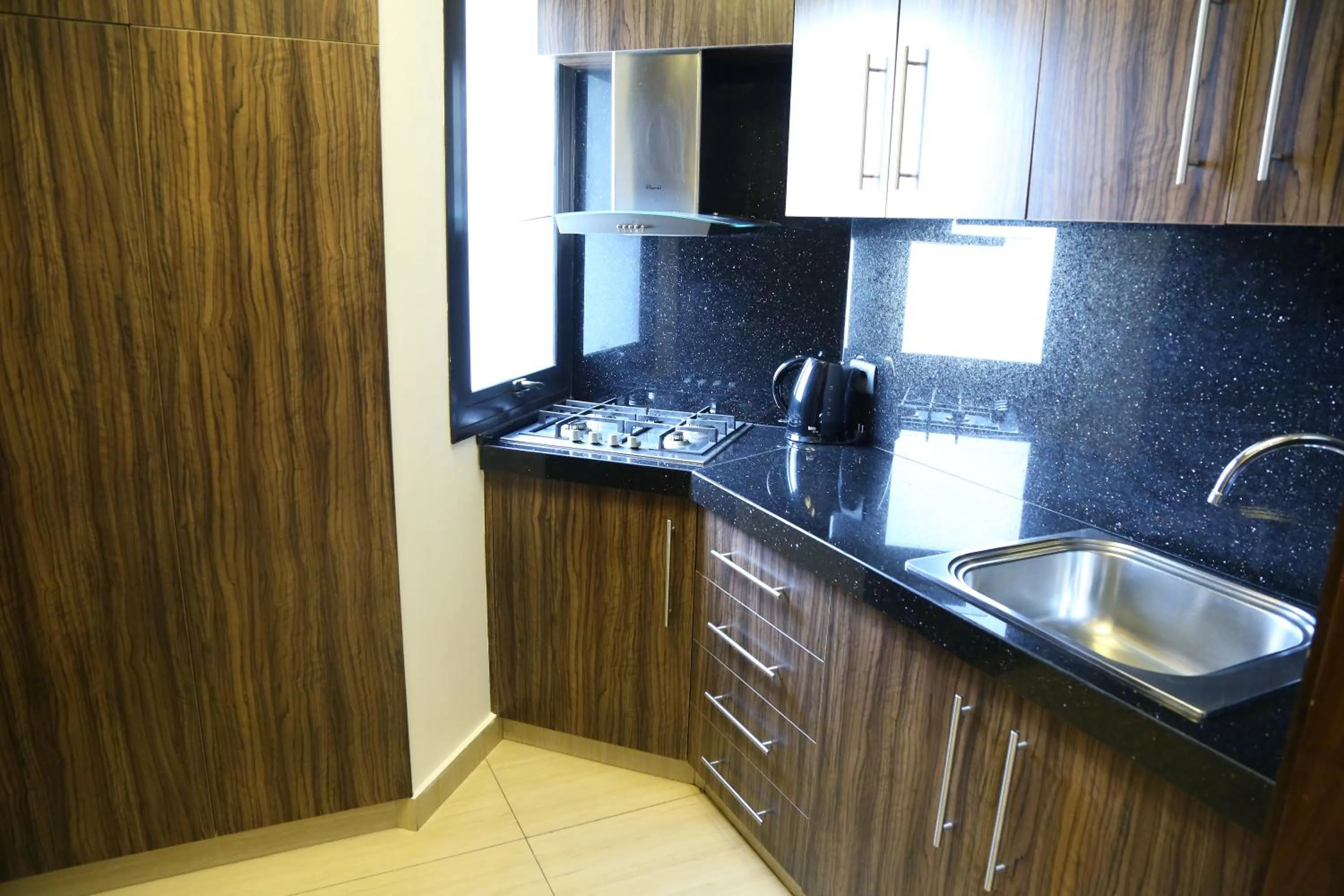 Kitchen or kitchenette in Verdun Suites Hotel