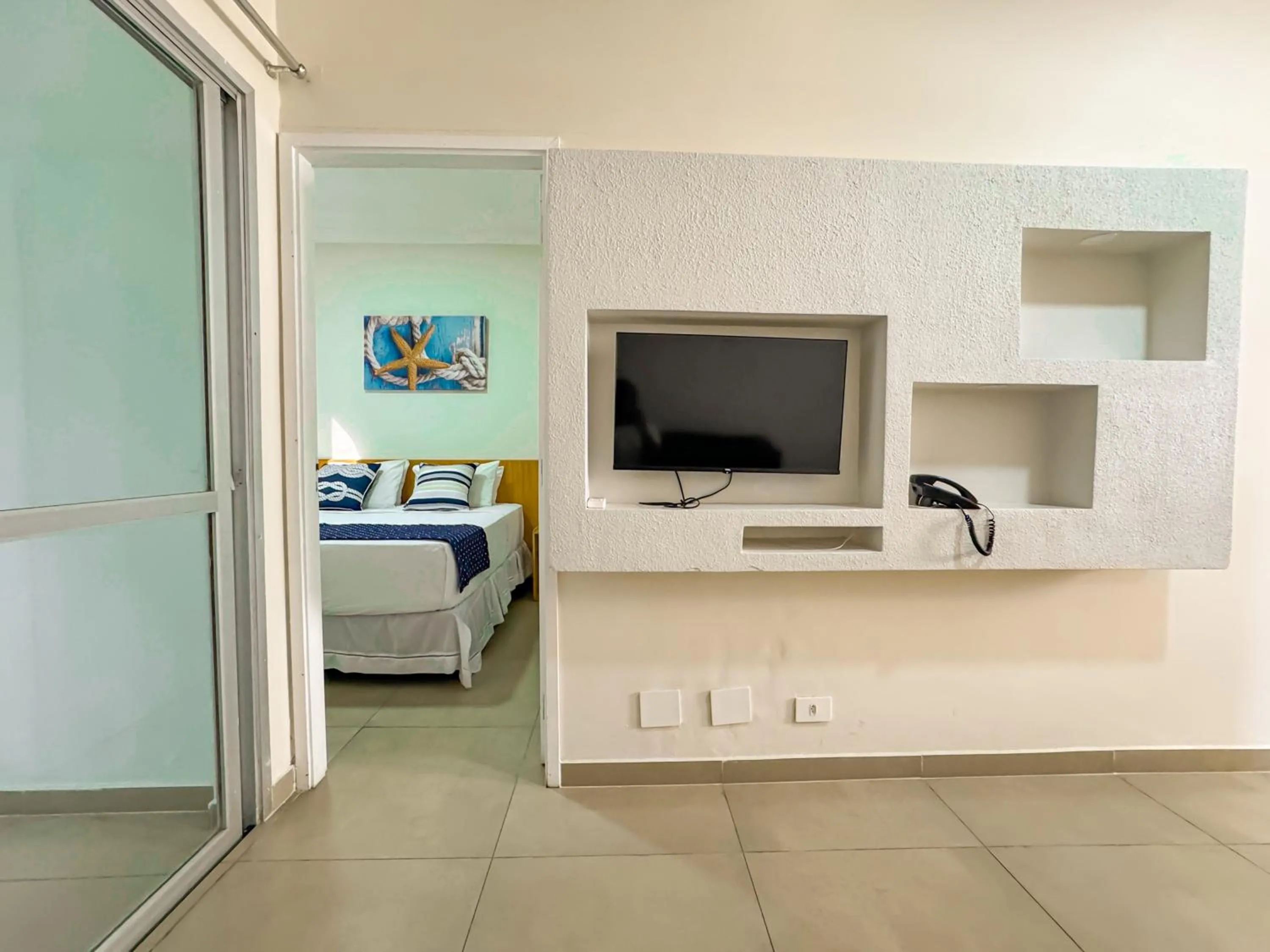 Seating area, Bed in Hotel Nacional Inn Guarujá